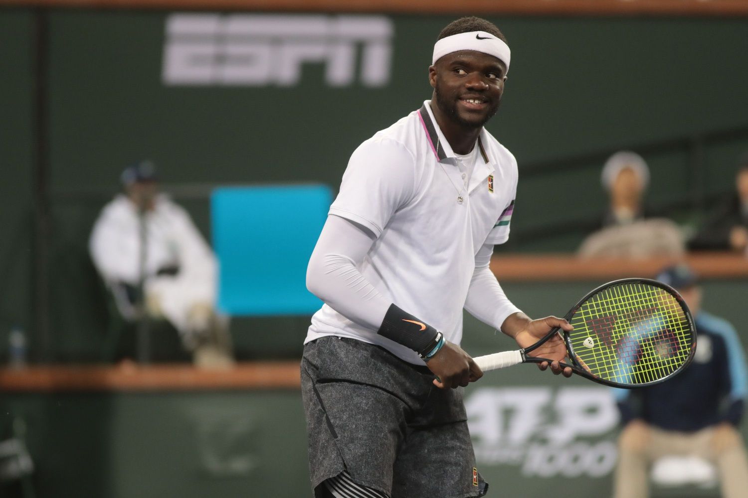 Frances Tiafoe smiles towards his team after winning a point against Nicolas Jarry at the BNP Paribas Open, Indian Wells, Calif., March 8, 2019.

Tiafoe 1