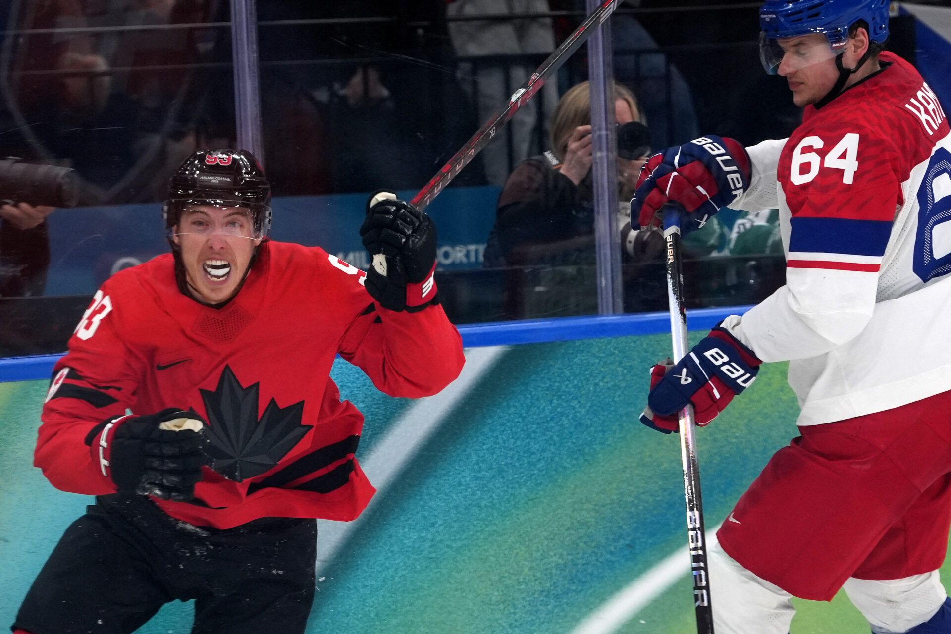 Mitch Marner of Canada celebrates after scoring their fourth goal in overtime to win the match against Czechia in a men's ice hockey quarterfinal during the Milano Cortina 2026 Olympic Winter Games at Milano Santagiulia Ice Hockey Arena.