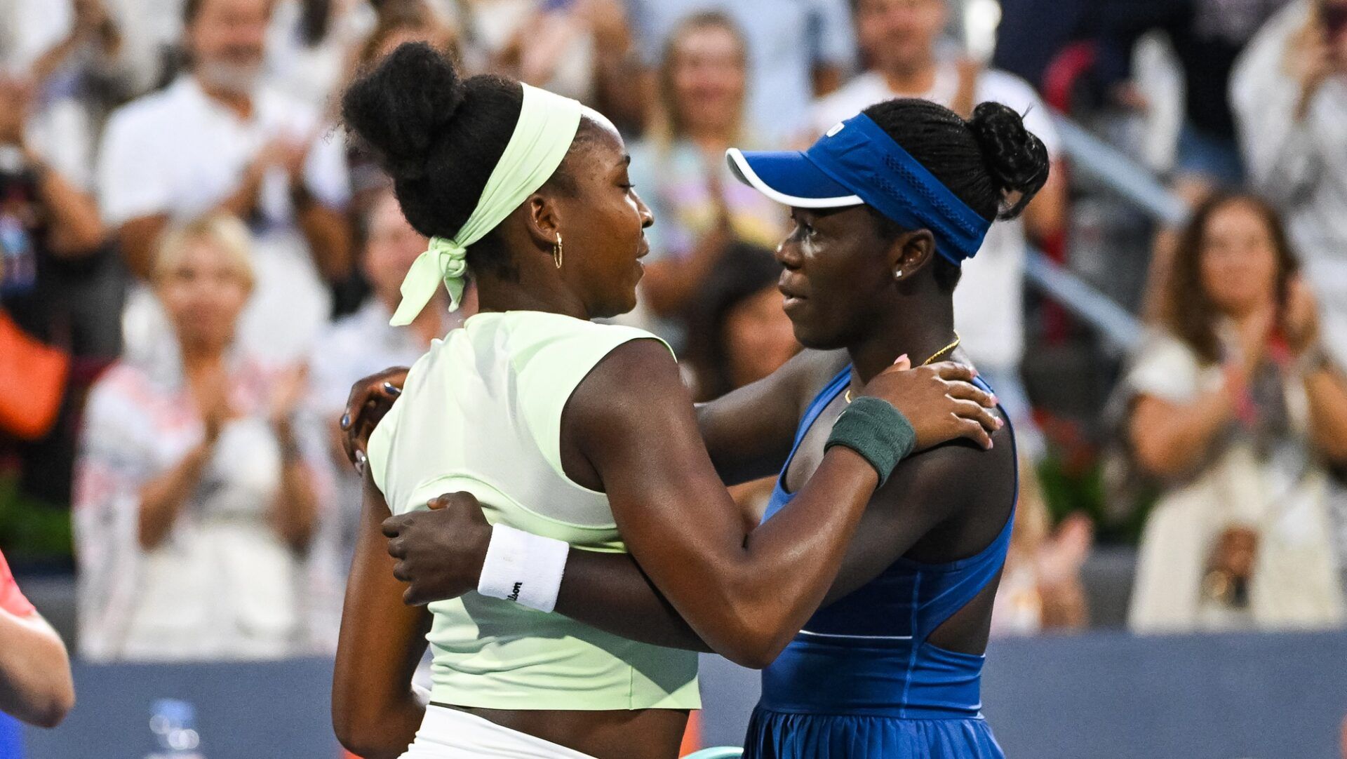 Coco Gauff (USA) congratulates Victoria Mboko (CAN) for her win in a fourth round match at IGA Stadium.