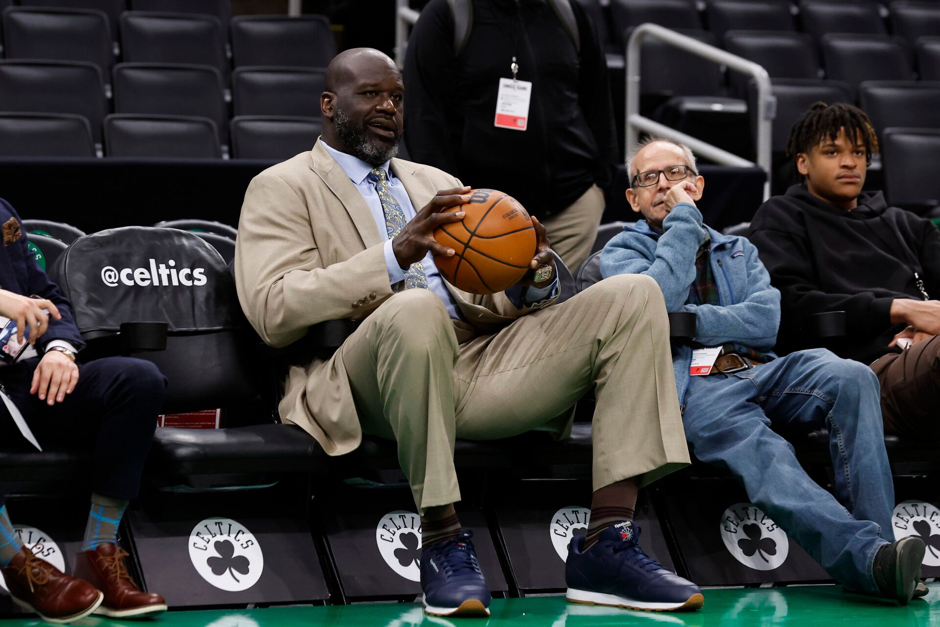 Shaquille OÕNeal holds a basketball courtside before game five of the Eastern Conference Finals between the Miami Heat and the Boston Celtics in the 2023 NBA playoffs at TD Garden.