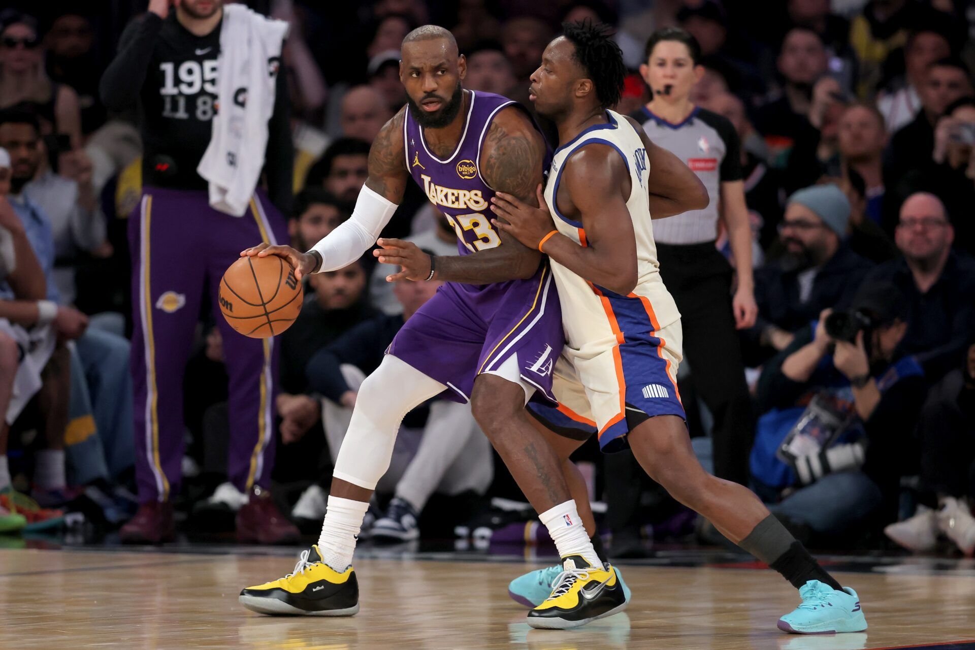 Los Angeles Lakers forward LeBron James (23) controls the ball against New York Knicks forward OG Anunoby (8) during the first quarter at Madison Square Garden.