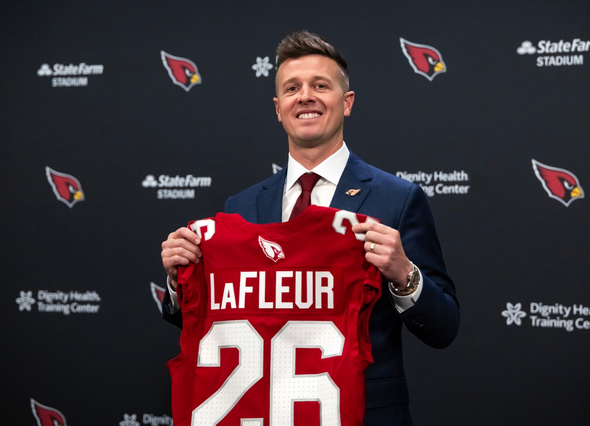 Arizona Cardinals head coach Mike LaFleur poses for photos at the introductory press conference at the Cardinals training facility.