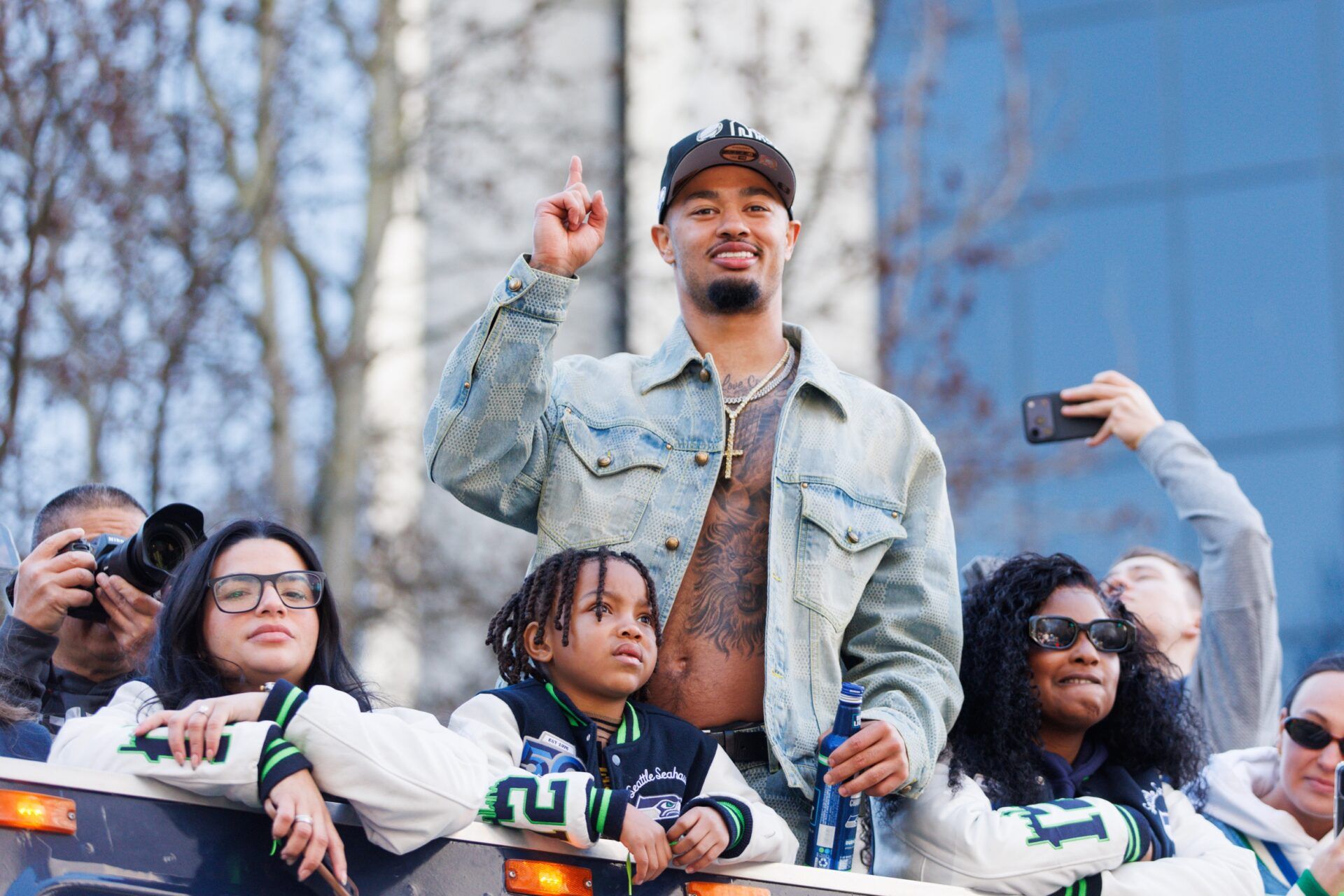 Seattle Seahawks wide receiver Jaxon Smith-Njigba (11) reacts during the Super Bowl LX parade.
