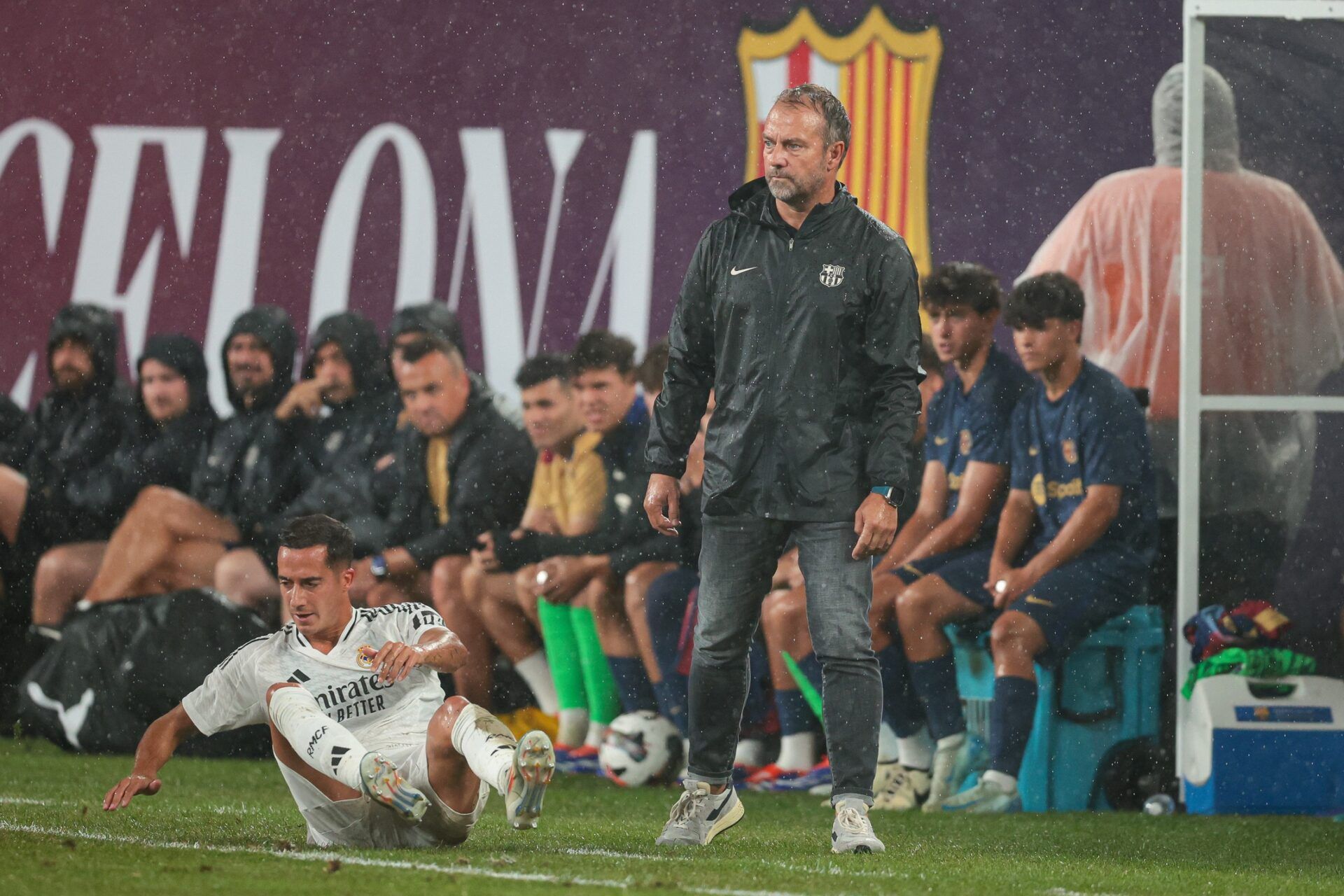 Barcelona head coach Hansi Flick looks on during the first half of an international friendly against Real Madrid at MetLife Stadium.