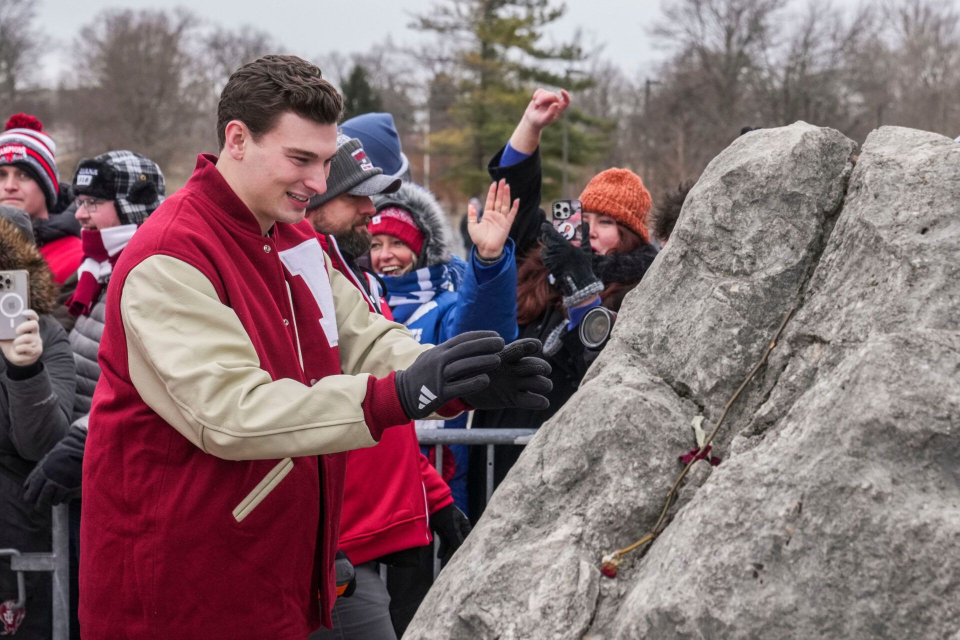 Indiana Hoosiers quarterback Fernando Mendoza touches the rock Saturday, Jan. 24, 2026, during a championship celebration for the Indiana Hoosiers at Memorial Stadium.