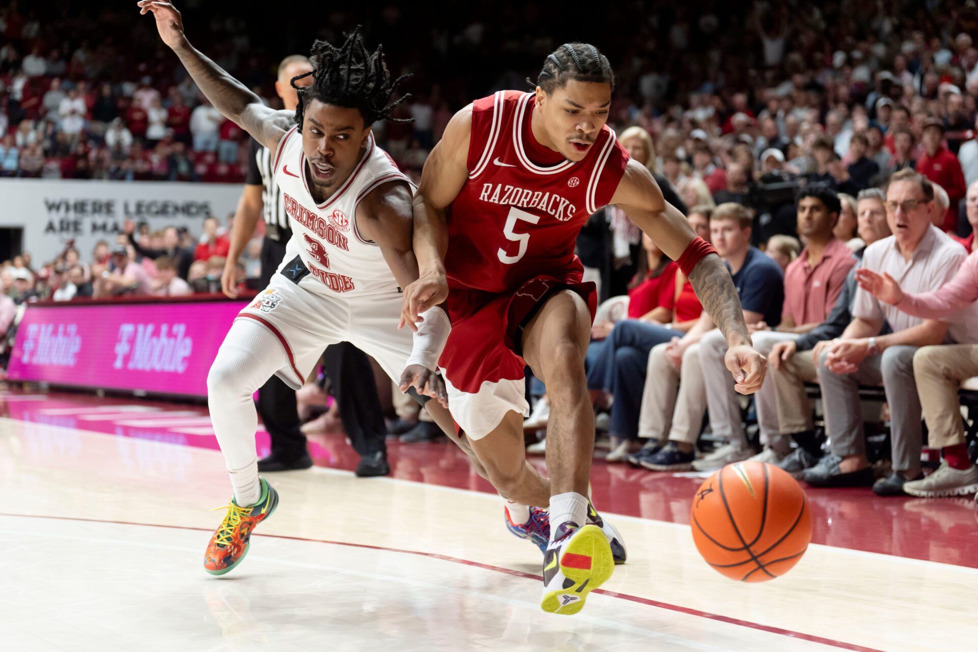 Alabama guard Latrell Wrightsell Jr. (3) and Arkansas guard Darius Acuff Jr. (5) fight for a ball that went out of bounds on Acuff Jr. at Coleman Coliseum. Alabama defeated Arkansas 117-115 in double overtime.