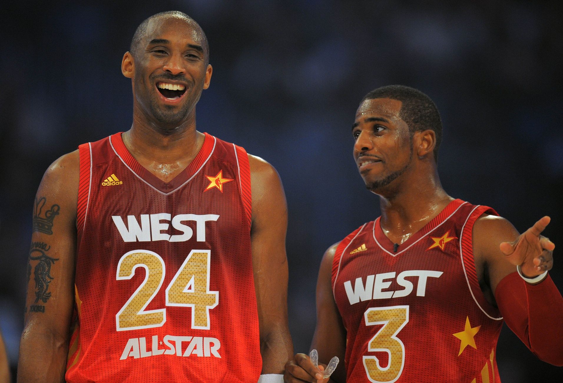 Western Conference guard Kobe Bryant of the Los Angeles Lakers (24) talks to Chris Paul of the Los Angeles Clippers in the 2012 NBA All-Star Game at the Amway Center.