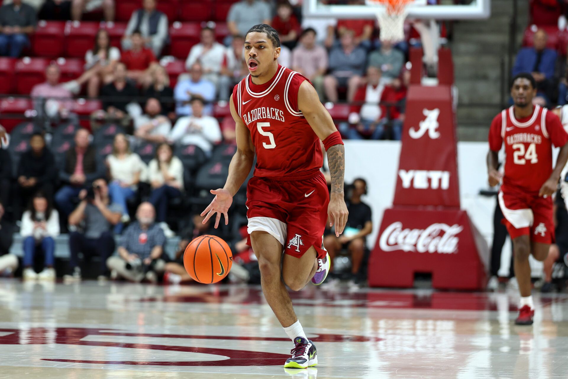 Arkansas Razorback guard Darius Acuff Jr. (5) dribbles a fast break during the first half against the Alabama Crimson Tide at Coleman Coliseum.