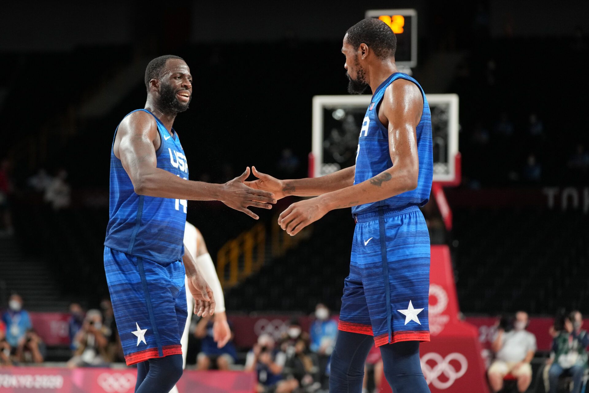 USA player Draymond Green (14), left, and USA player Kevin Durant (7) congratulate each other as USA beat Spain during the Tokyo 2020 Olympic Summer Games at Saitama Super Arena.