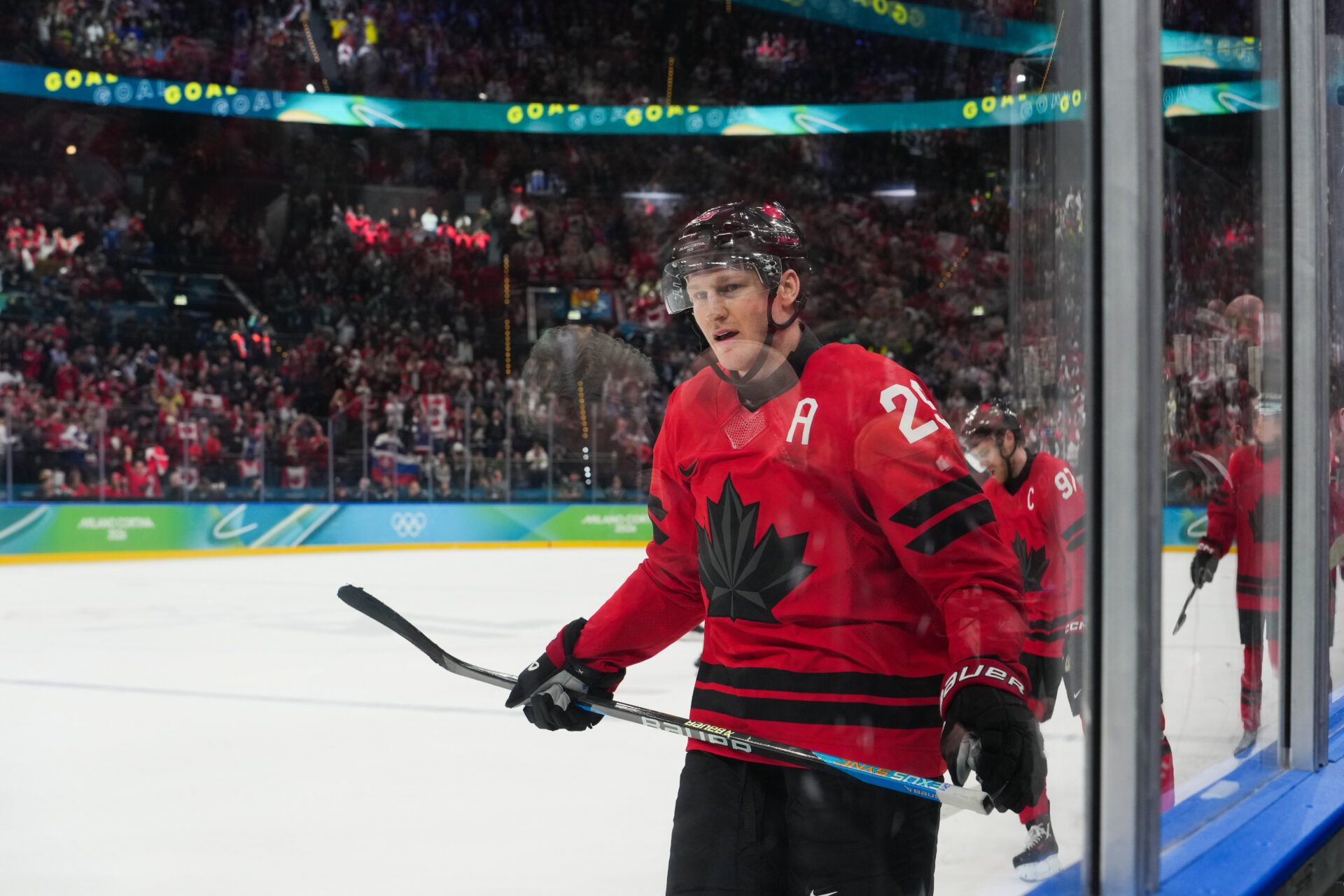 Nathan MacKinnon (29) of Canada celebrates after scoring a goal during the third period against Finland in a men's ice hockey semifinal during the Milano Cortina 2026 Olympic Winter Games at Milano Santagiulia Ice Hockey Arena.