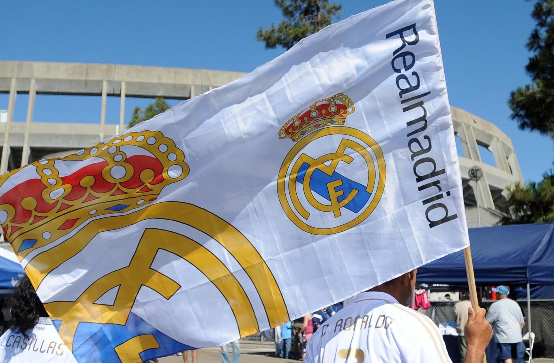 A Real Madrid fan waves a team flag prior to the game against CD Guadalajara at Qualcomm Stadium.