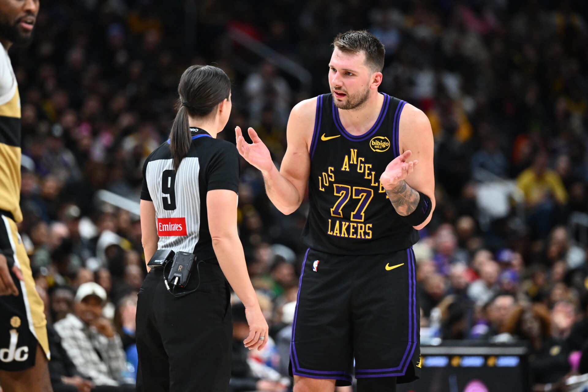 Los Angeles Lakers forward/guard Luka Doncic (77) talks with referee Natalie Sago (9) during the second half at Capital One Arena.