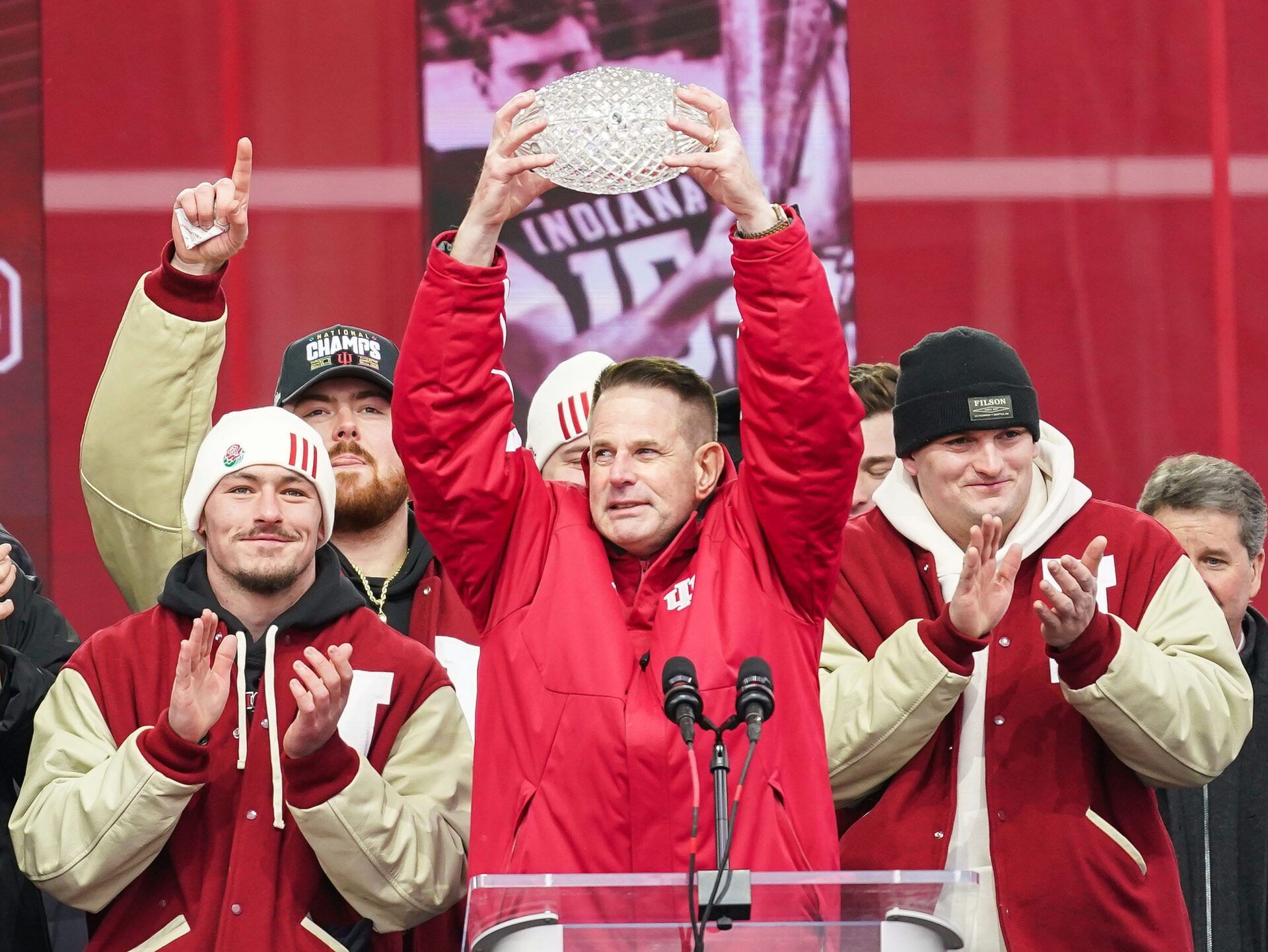 Indiana Hoosiers head coach Curt Cignetti holds up the coaches trophy on Saturday, Jan. 24, 2026, during the Indiana Football College Football Playoff National Championship celebration and parade at Memorial Stadium in Bloomington.