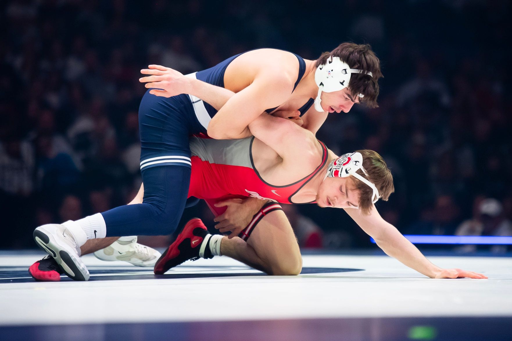 Penn State's PJ Duke, top, defeats Ohio State's Daxton Chase at 157 pounds during a Big Ten wrestling dual inside the Bryce Jordan Center on February, 13, 2026. Duke won by fall at 3:28.