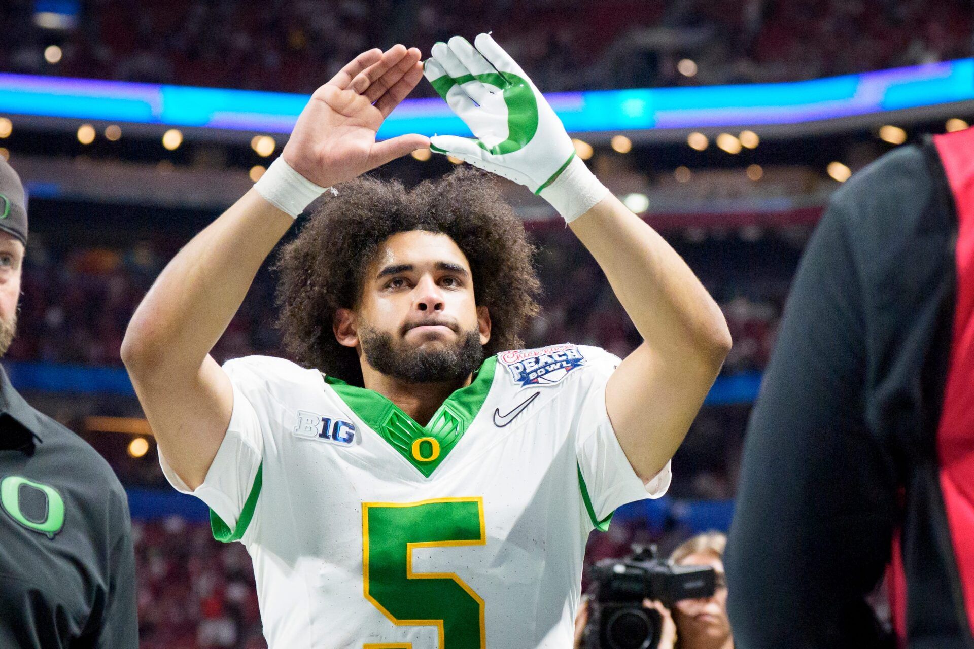 Oregon quarterback Dante Moore walks off the field as the Oregon Ducks face the Indiana Hoosiers in the Peach Bowl on Jan. 9, 2026, at Mercedes-Benz Stadium in Atlanta, Georgia.