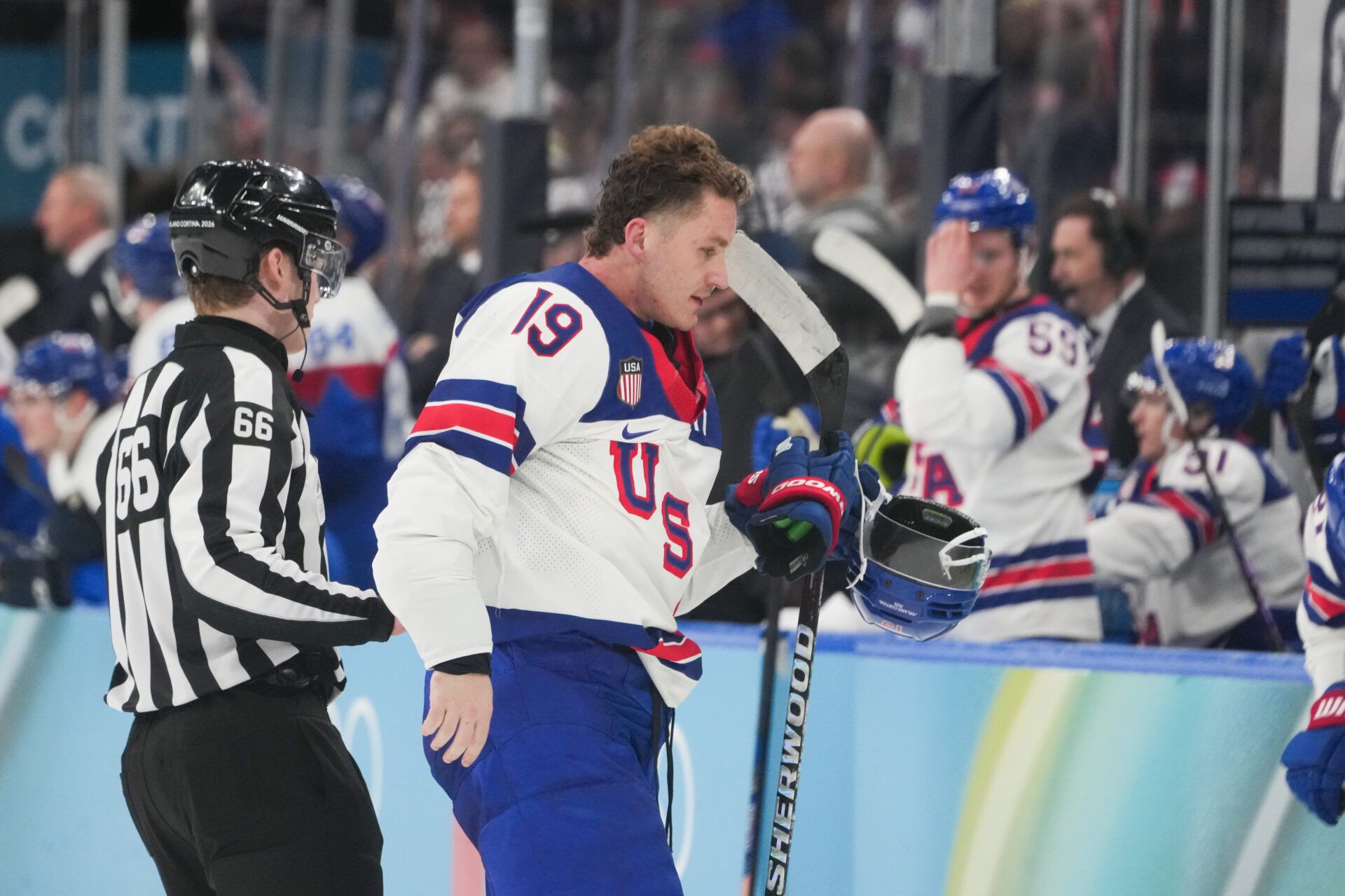 Matthew Tkachuk (19) of the United States leaves the game during the third period in a men's ice hockey semifinal during the Milano Cortina 2026 Olympic Winter Games at Milano Santagiulia Ice Hockey Arena.