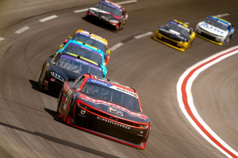 Xfinity Series driver Jeb Burton (27) leads other drivers into turn four at Atlanta Motor Speedway.