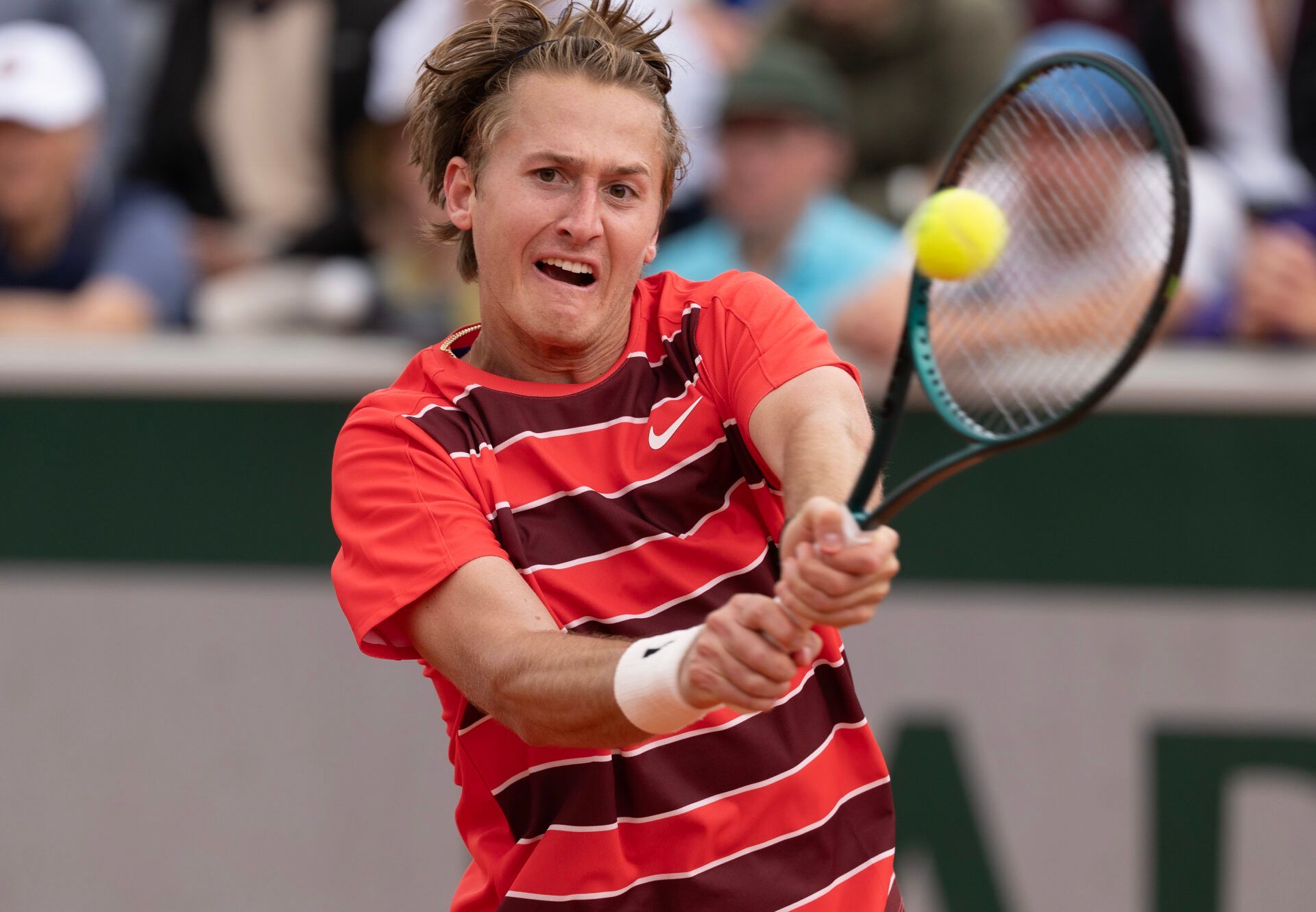 Sebastian Korda of the United States returns a shot during his match against Luciano Darderi of Italy on day two at Roland Garros Stadium.
