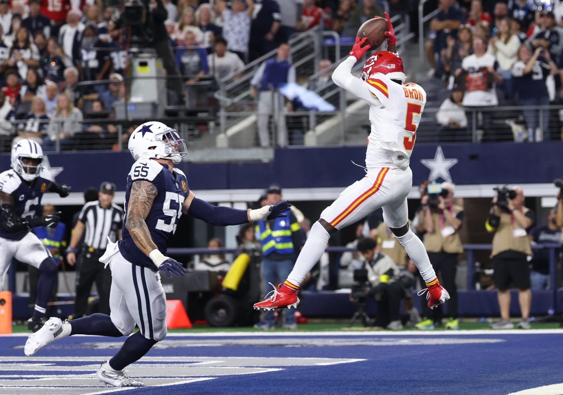 Kansas City Chiefs wide receiver Hollywood Brown (5) catches a pass for a touchdown against Dallas Cowboys linebacker Logan Wilson (55) during the fourth quarter at AT&T Stadium.