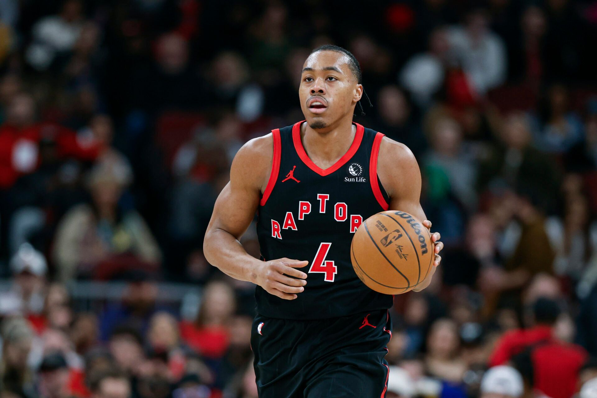Toronto Raptors forward Scottie Barnes (4) brings the ball up court against the Chicago Bulls during the first half at United Center.