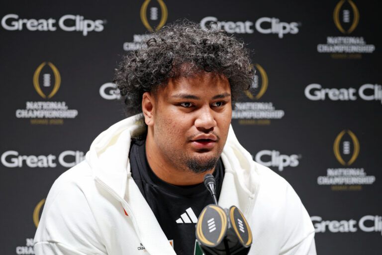 Miami Hurricanes offensive lineman Francis Mauigoa (61)talks to the media during media day for the 2025 College Football Playoff National Championship at Miami Beach Convention Center.