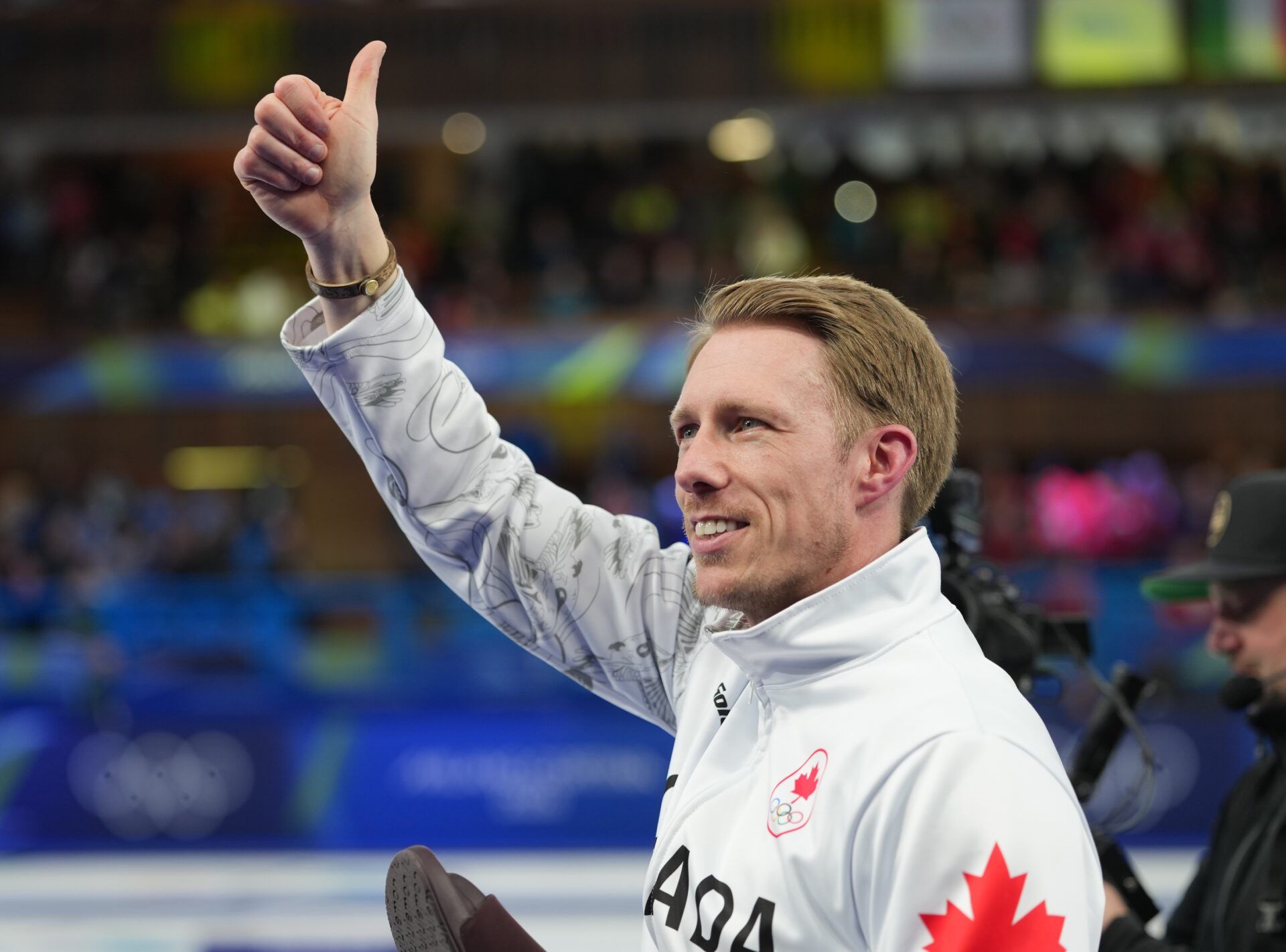 Marc Kennedy of Canada celebrates after defeating Great Britain in the men's curling gold medal game during the Milano Cortina 2026 Olympic Winter Games at Cortina Curling Olympic Stadium.