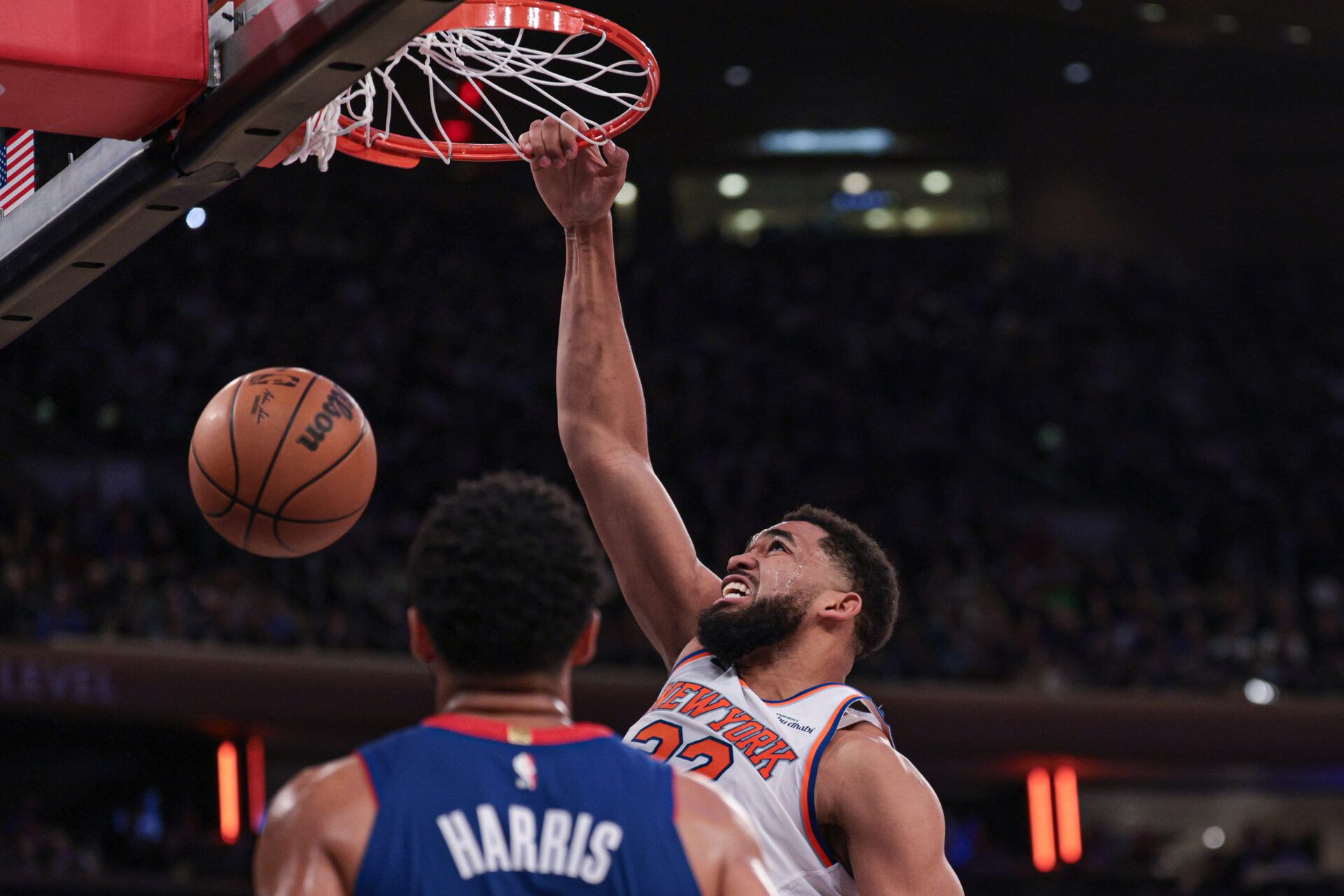 New York Knicks center Karl-Anthony Towns (32) dunks during the first half in front of Detroit Pistons forward Tobias Harris (12) at Madison Square Garden.