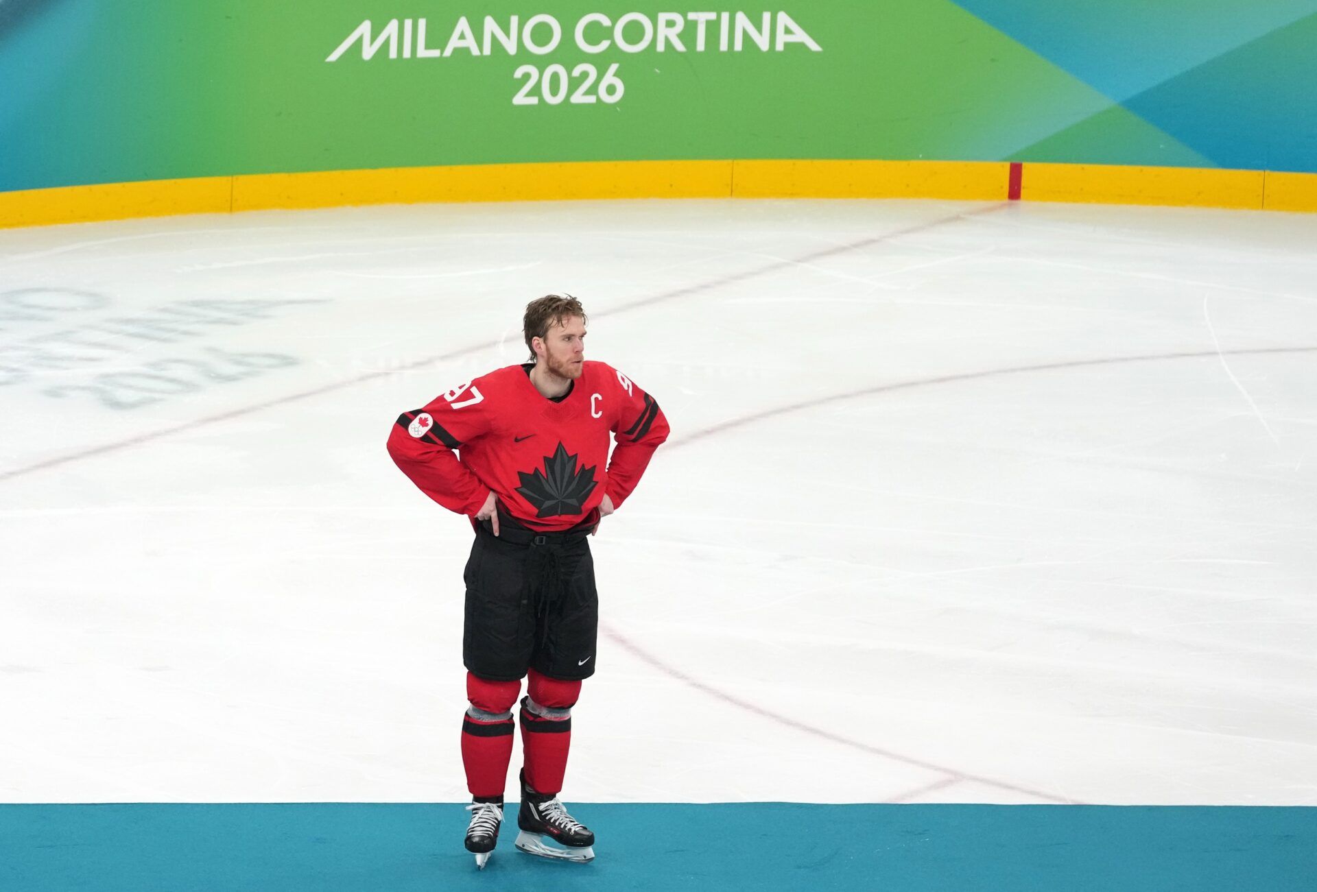 Matthew Tkachuk of the United States and Connor McDavid of Canada reacts after the men's ice hockey gold medal game during the Milano Cortina 2026 Olympic Winter Games at Milano Santagiulia Ice Hockey Arena.