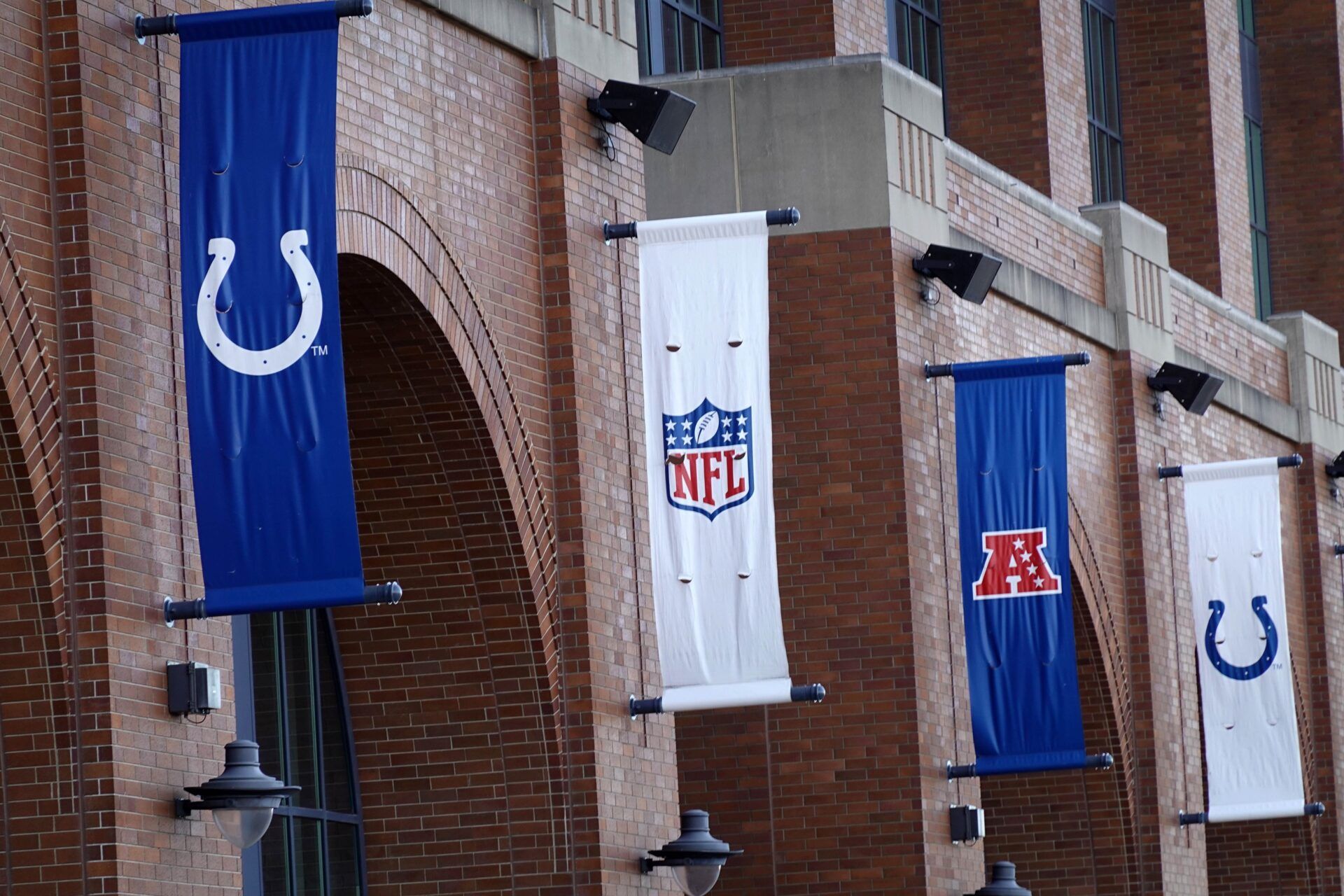 Indianapolis Colts, NFL shield logo and AFC banners at Lucas Oil Stadium.