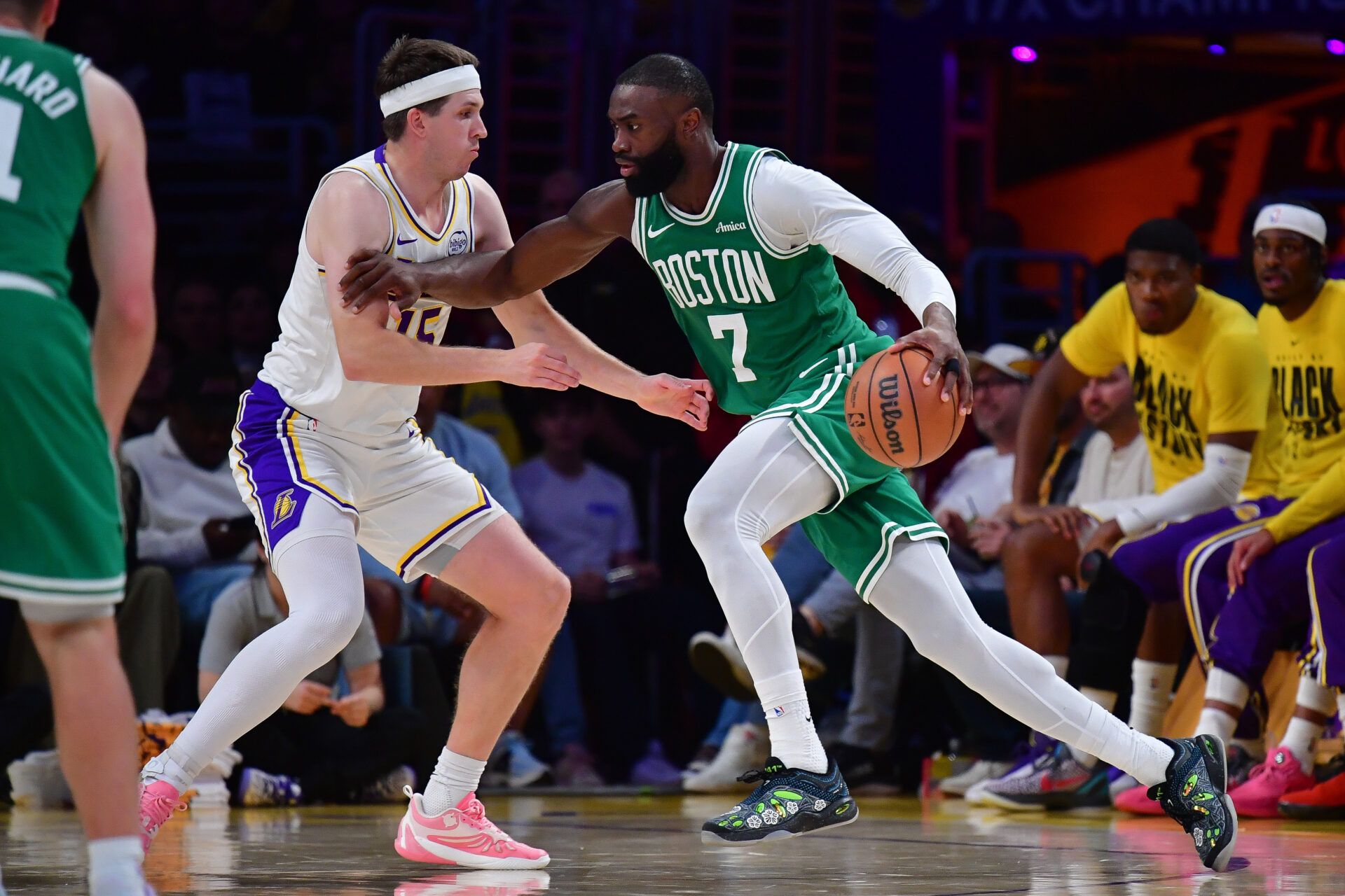 Boston Celtics guard Jaylen Brown (7) moves the ball against Los Angeles Lakers guard Austin Reaves (15) during the second half at Crypto.com Arena.