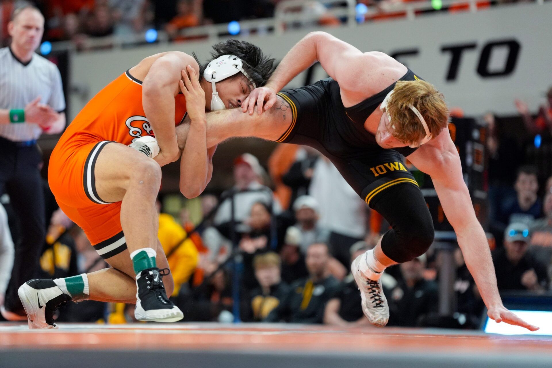 Oklahoma State's Cody Merrill, left, wrestles Iowa's Brody Sampson at 197 pounds during a college wrestling dual between the Oklahoma State University Cowboys (OSU) and the Iowa Hawkeyes at Gallagher-Iba Arena in Stillwater, Okla., Sunday, Feb. 22, 2026.