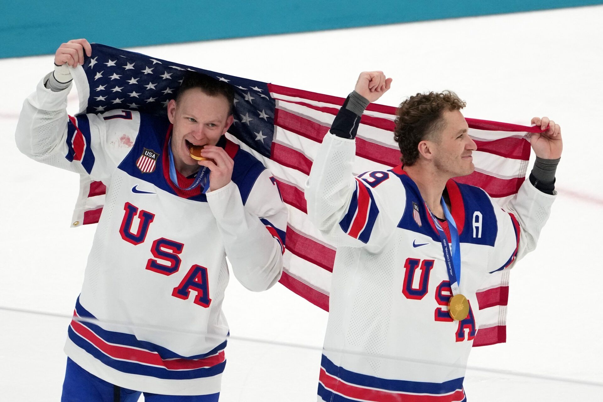 Brady Tkachuk and Matthew Tkachuk of the United States celebrate after winning the men's ice hockey gold medal game during the Milano Cortina 2026 Olympic Winter Games at Milano Santagiulia Ice Hockey Arena.