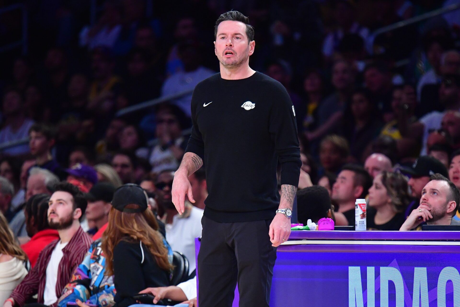Los Angeles Lakers head coach JJ Redick watches game action against the Boston Celtics during the first half at Crypto.com Arena.