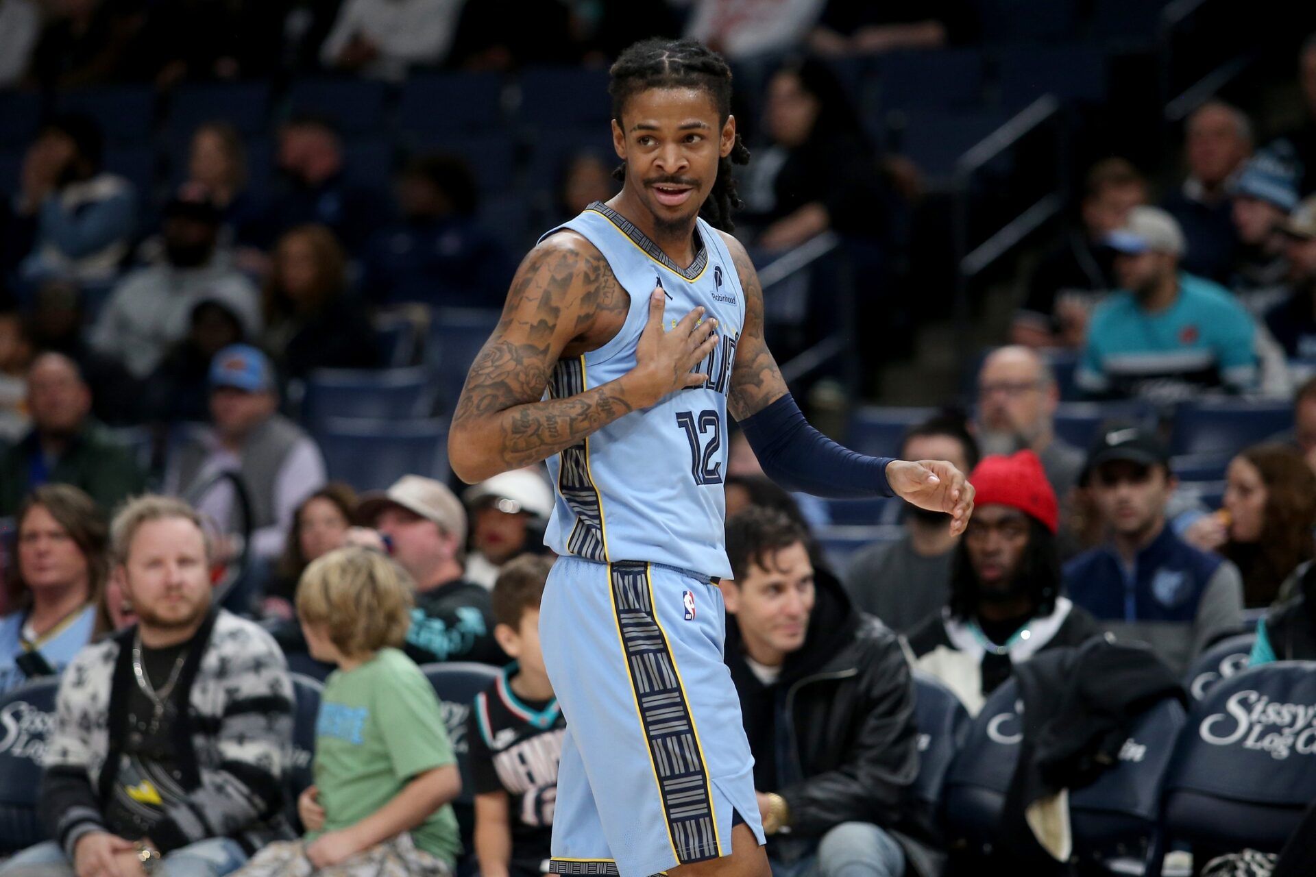 Memphis Grizzlies guard Ja Morant (12) reacts during the first quarter against the Atlanta Hawks at FedExForum.