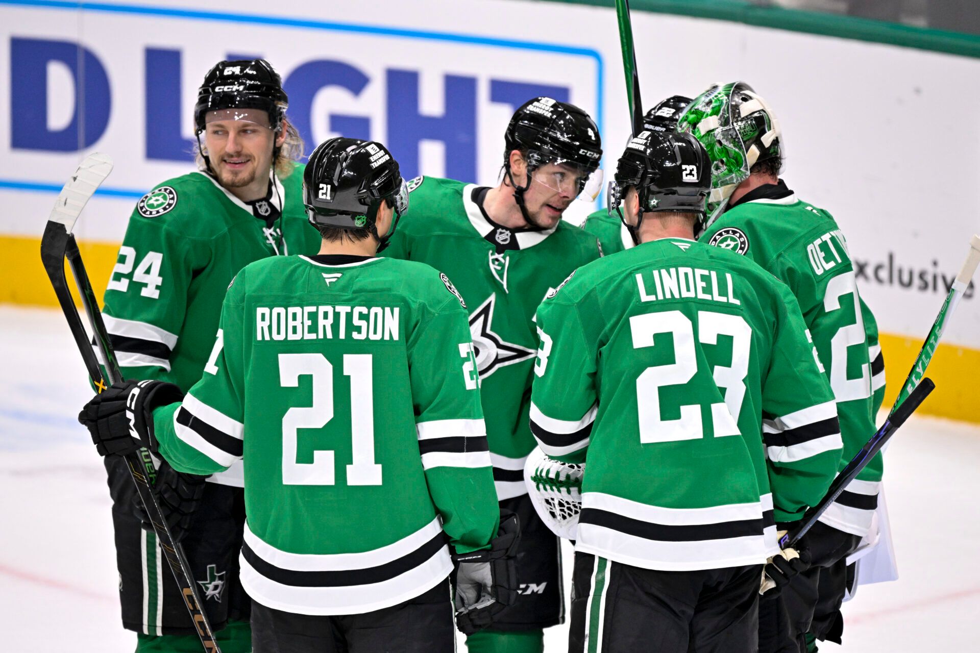 Dallas Stars center Roope Hintz (24) and defenseman Miro Heiskanen (4) and left wing Jason Robertson (21) and defenseman Esa Lindell (23) and goaltender Jake Oettinger (29) celebrate after the Stars defeat the St. Louis Blues at the American Airlines Center.