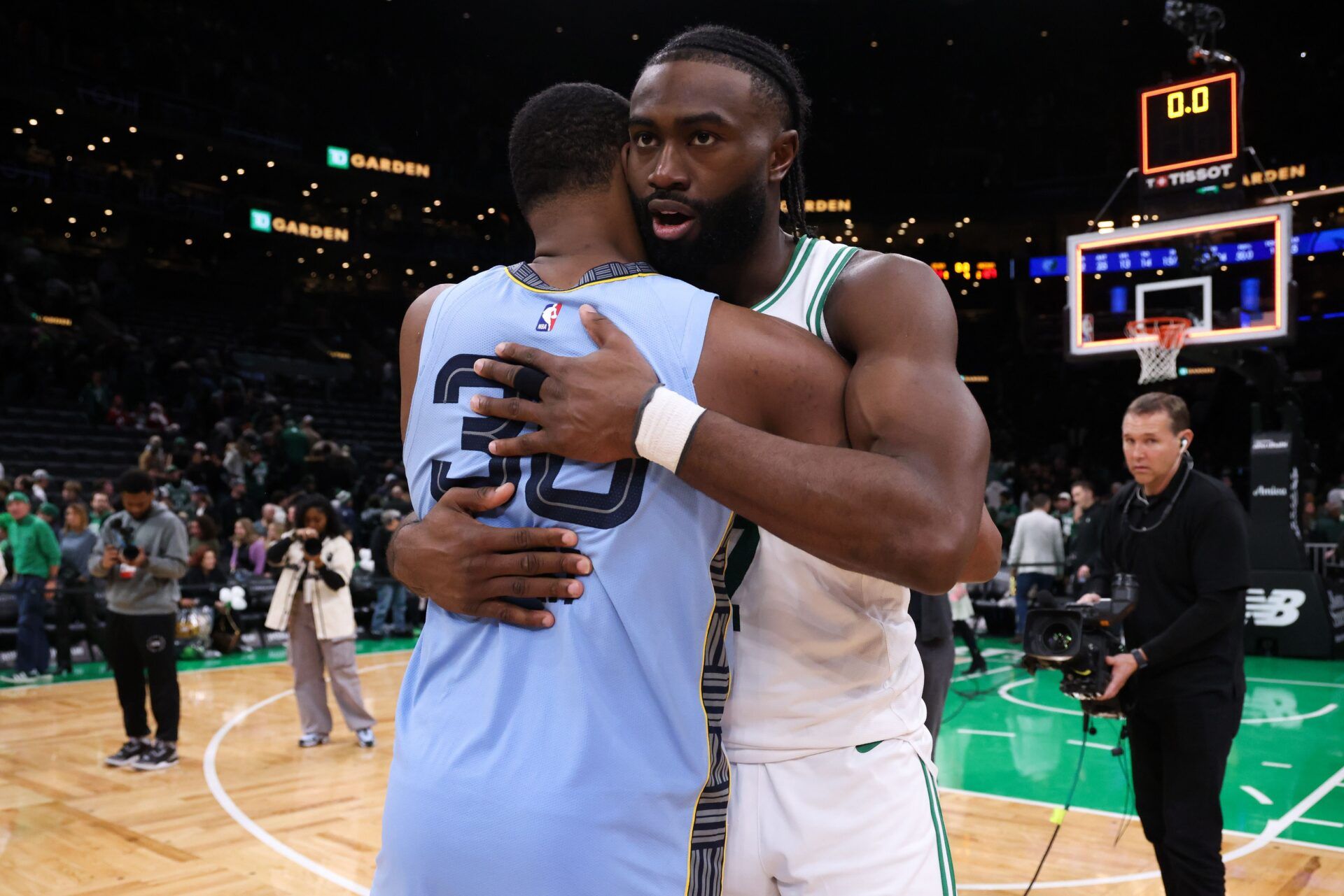 Boston Celtics forward Jaylen Brown (7) and Memphis Grizzlies guard Marcus Smart (36) hug after the Memphis Grizzlies defeat the Boston Celtics at TD Garden.
