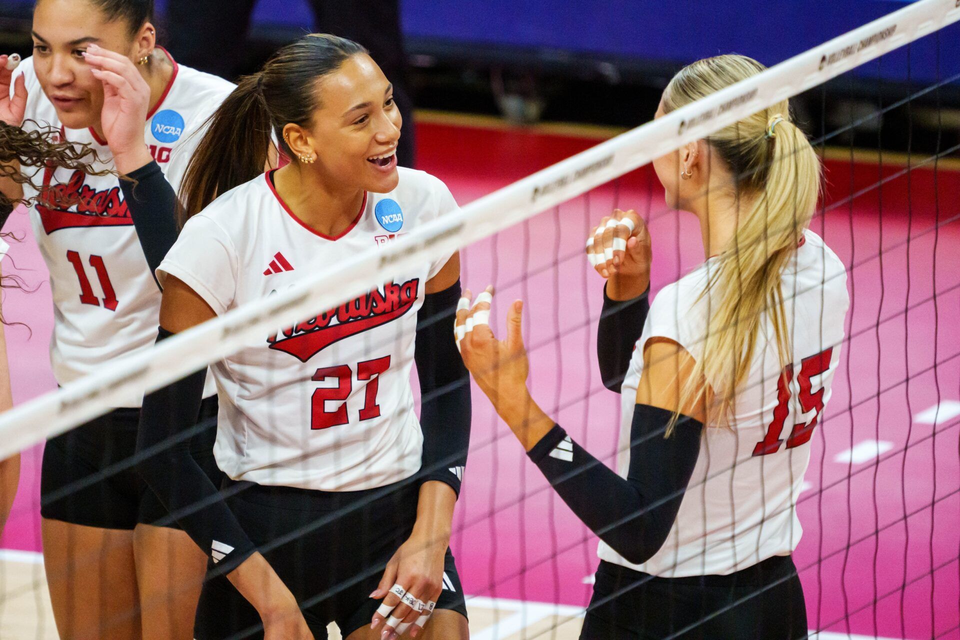 Nebraska Cornhuskers outside hitter Harper Murray (27) and middle blocker Andi Jackson (15) react after a point against the Texas A&M Aggies during the first set at Bob Devaney Sports Center.