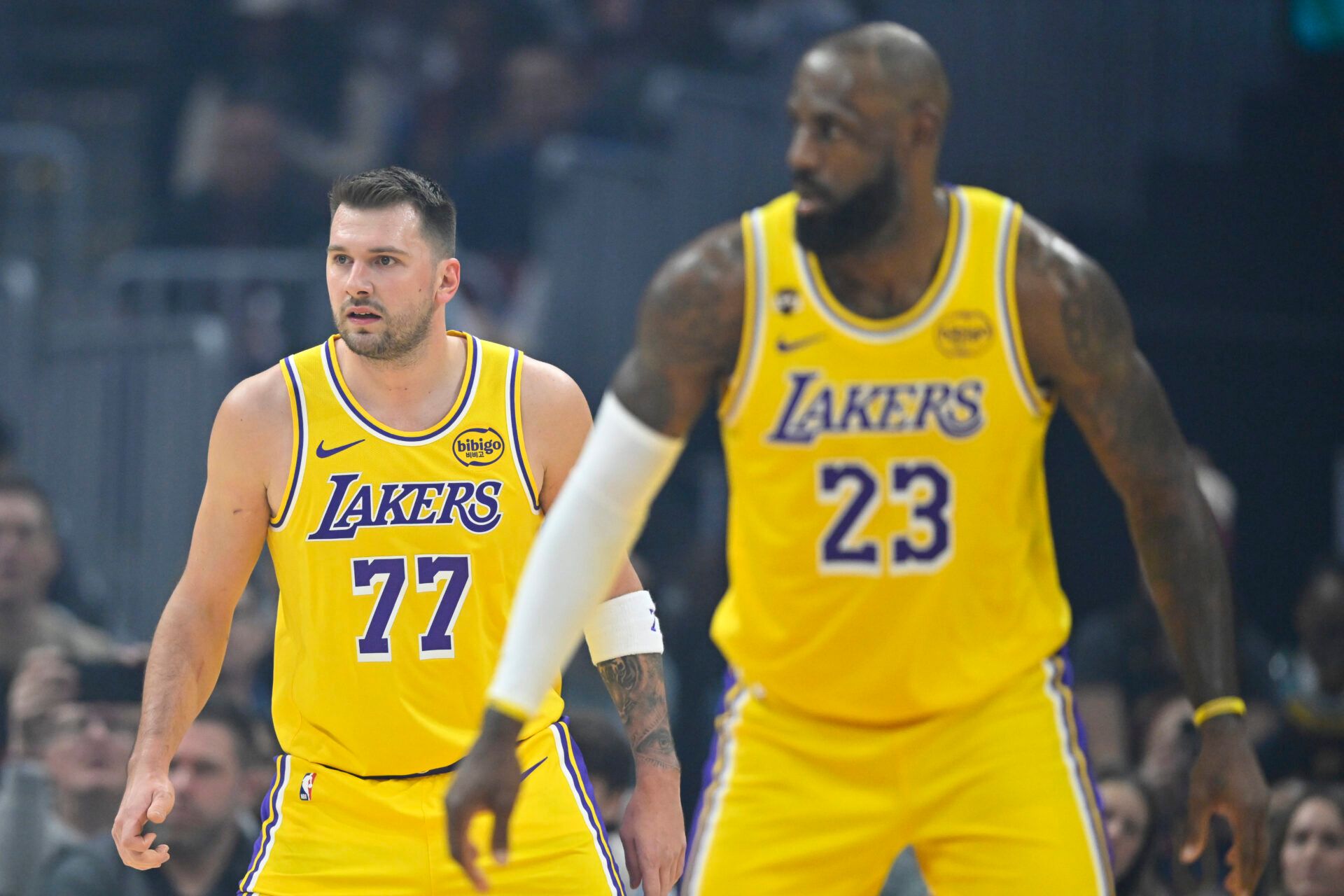 Los Angeles Lakers guard Luka Doncic (77) and forward LeBron James (23) stand on the court in the first quarter against the Cleveland Cavaliers at Rocket Arena.