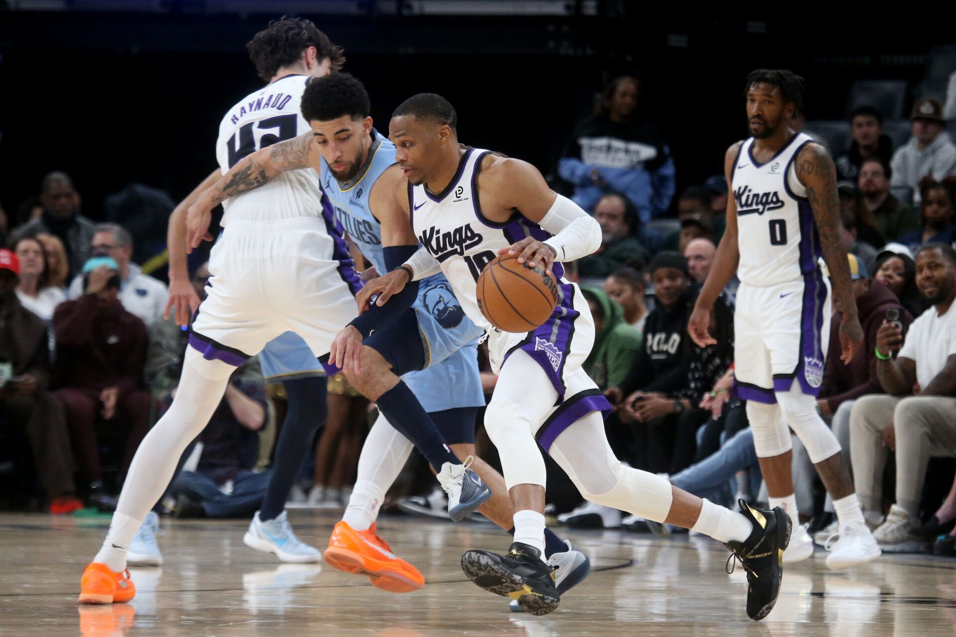 Sacramento Kings guard Russell Westbrook (18) dribbles around a screen set by center Maxime Raynaud (42) on Memphis Grizzlies guard Scotty Pippen Jr. (1) during the fourth quarter at FedExForum.