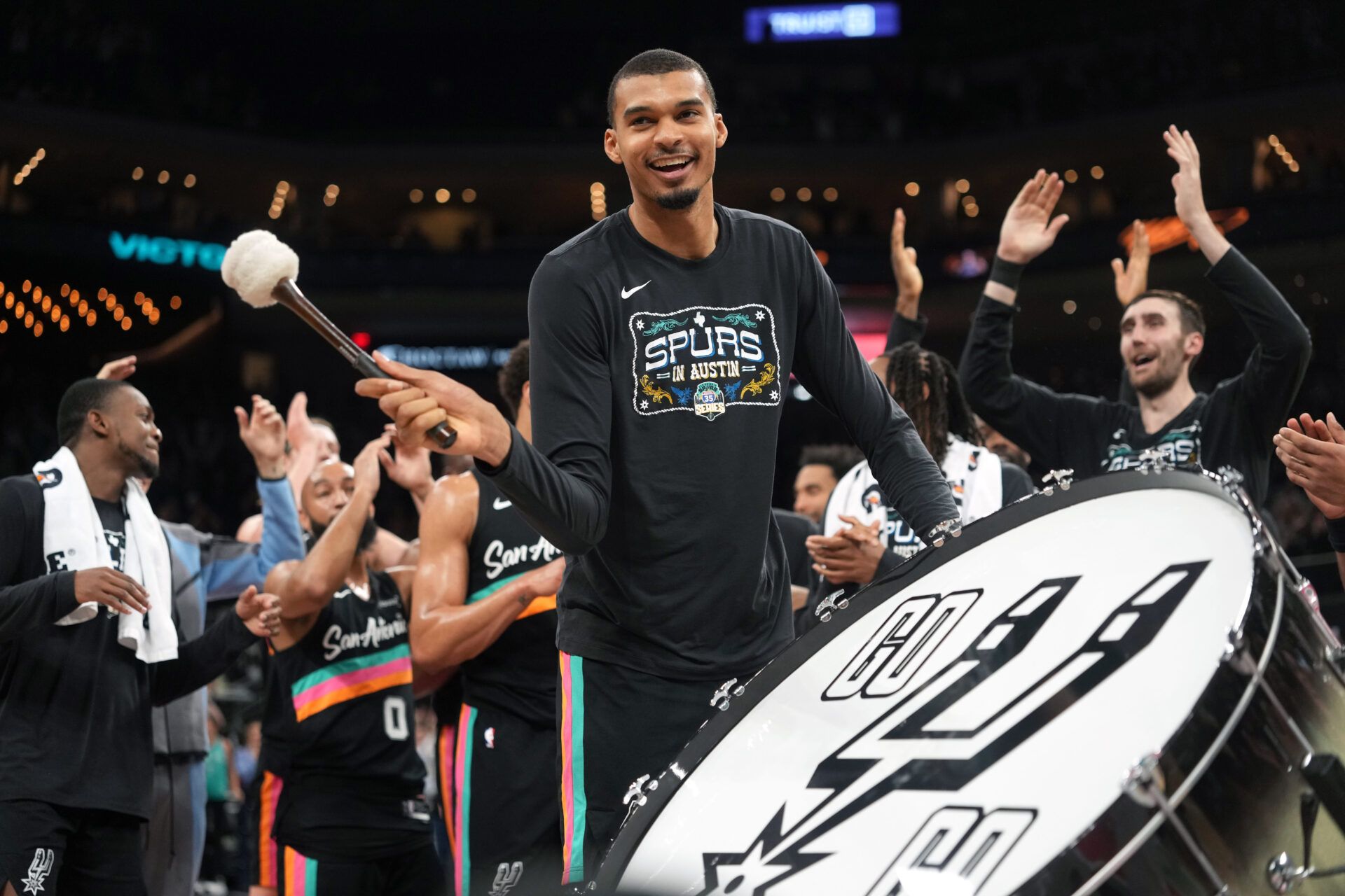 San Antonio Spurs forward Victor Wembanyama (1) leads the crowd in a cheer after a victory over the Phoenix Suns at Moody Center.