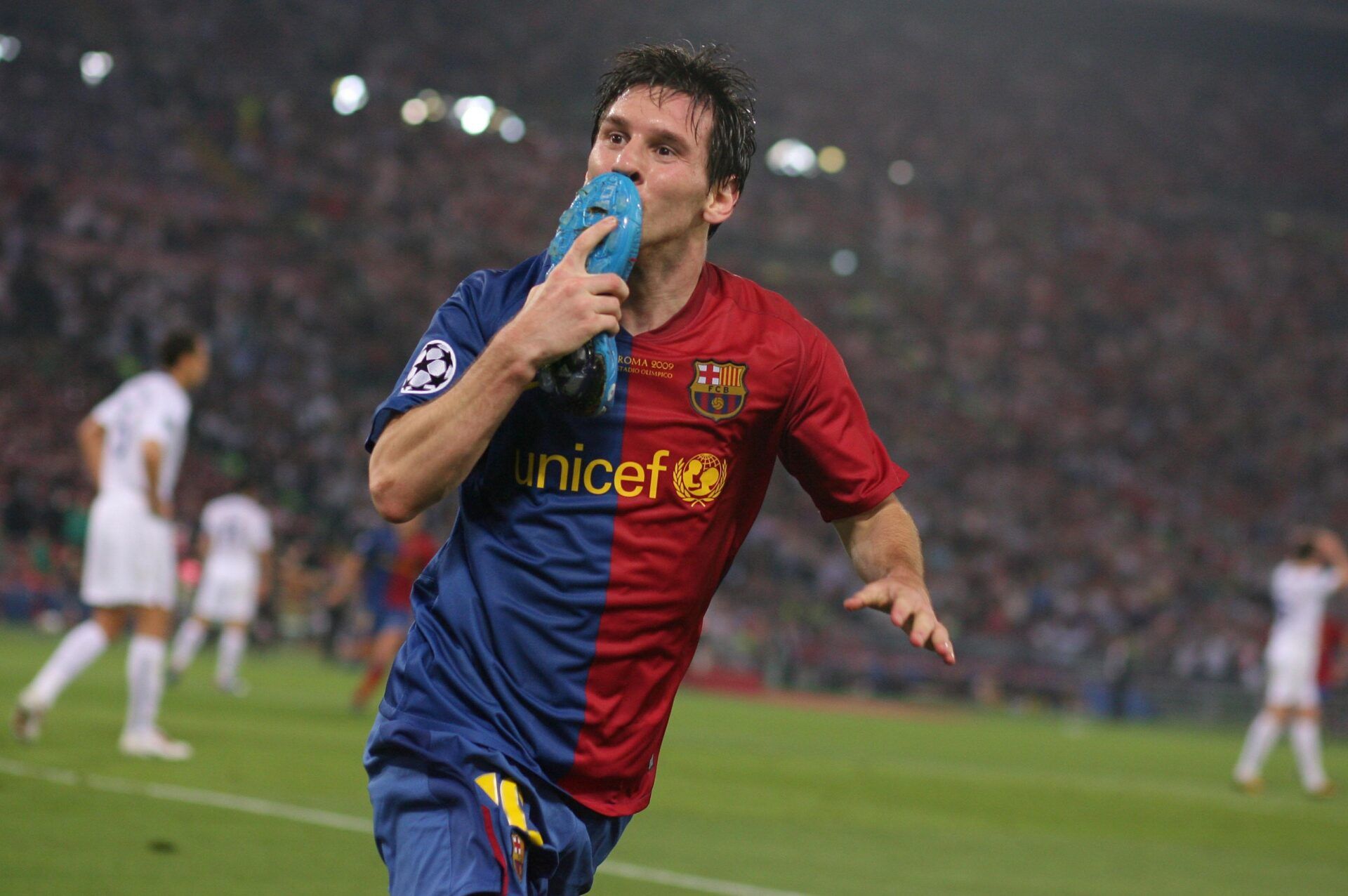 Lionel Messi kisses his blue boot after scoring the Barcelona 2nd goal of the match against Manchester United in the 2009 Champions League final. Barcelona defeated Manchester 2-0 at Olympico Stadium.