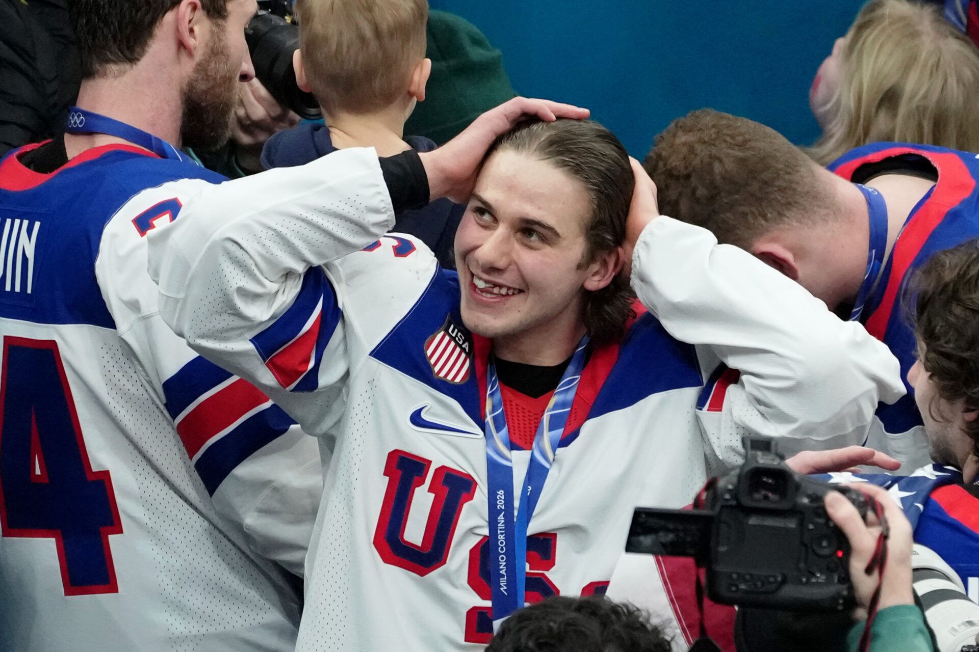 Jack Hughes of the United States celebrates after winning the men's ice hockey gold medal game during the Milano Cortina 2026 Olympic Winter Games at Milano Santagiulia Ice Hockey Arena.