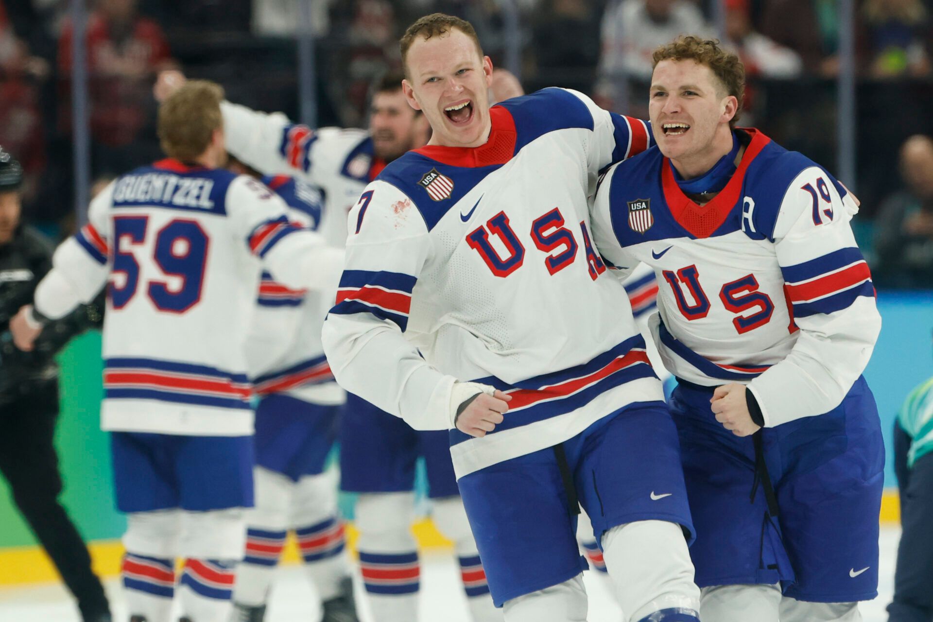 Brady Tkachuk #7 of Team United States and Matthew Tkachuk #19 of Team United States celebrate after their game against Team Canada during the Milano Cortina 2026 Olympic Winter Games at Milano Santagiulia Ice Hockey Arena.