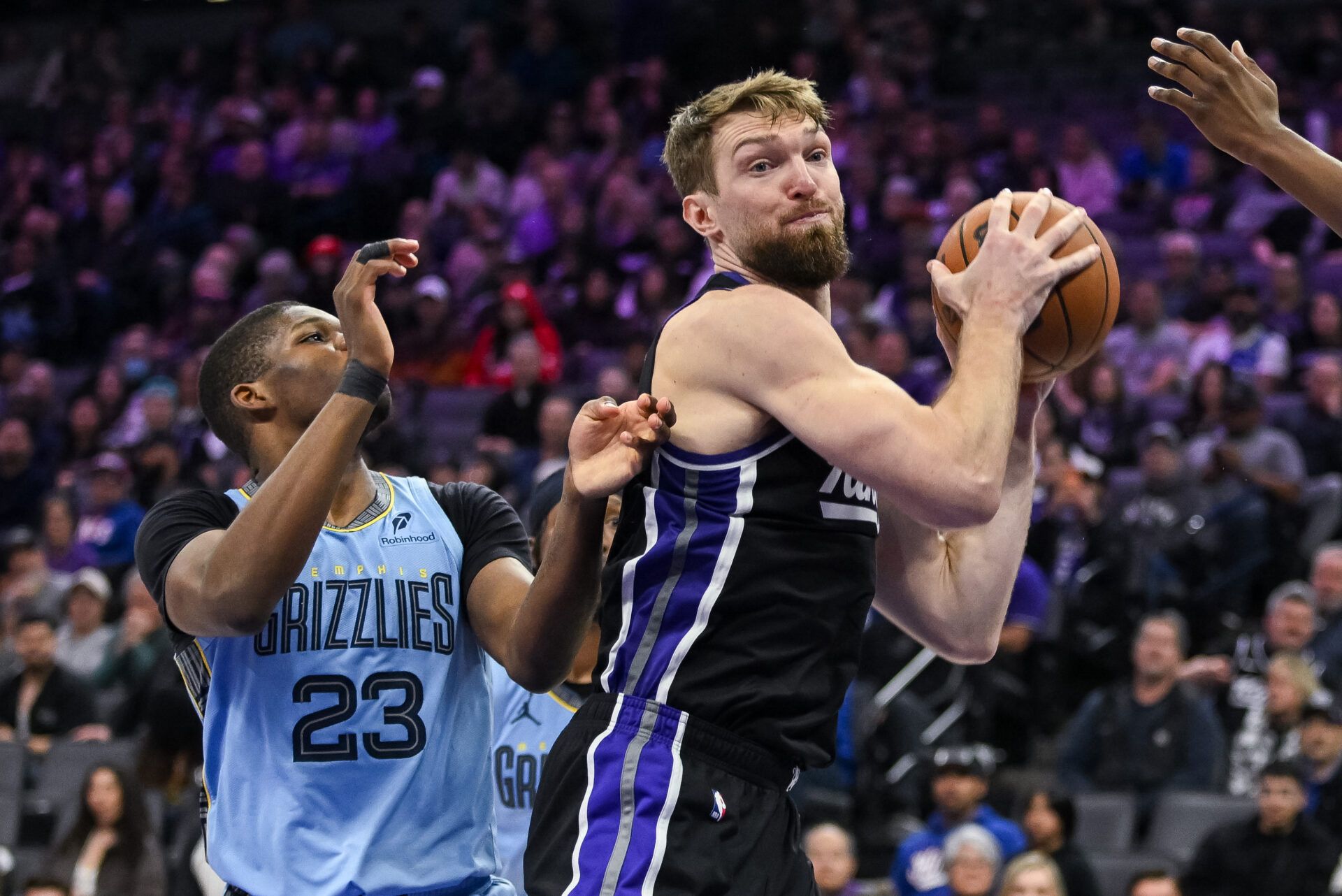 Sacramento Kings forward/center Domantas Sabonis (11) rebounds tagainst Memphis Grizzlies guard Cedric Coward (23) during the third quarter at Golden 1 Center.