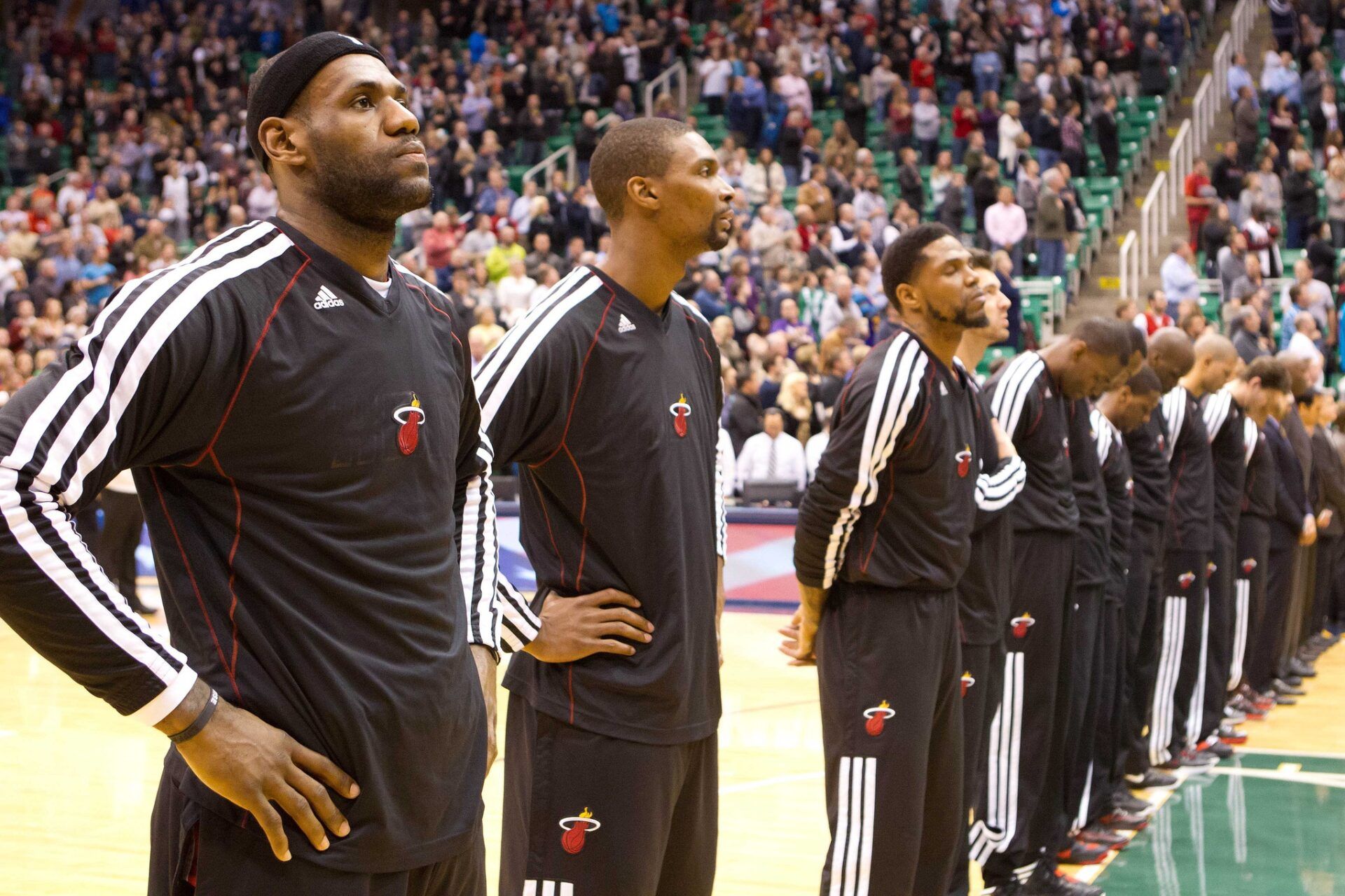 Miami Heat small forward LeBron James (far left) and center Chris Bosh (next to James) and their teammates during the National Anthem prior to a game against the Utah Jazz at EnergySolutions Arena. The Jazz won 104-97.