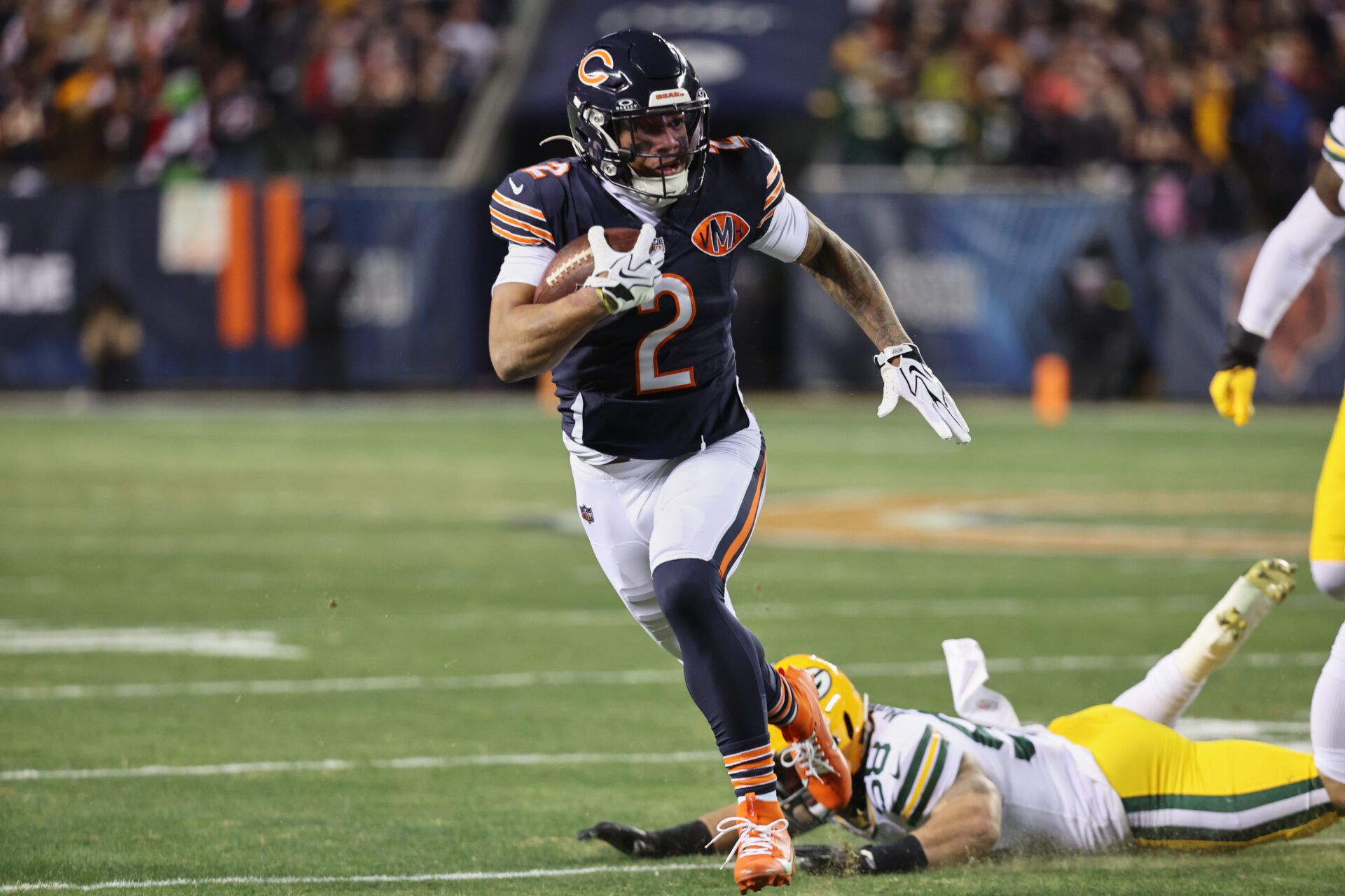 Chicago Bears wide receiver DJ Moore (2) runs after the catch against Green Bay Packers guard Lecitus Smith (68) during the first quarter at Soldier Field.
