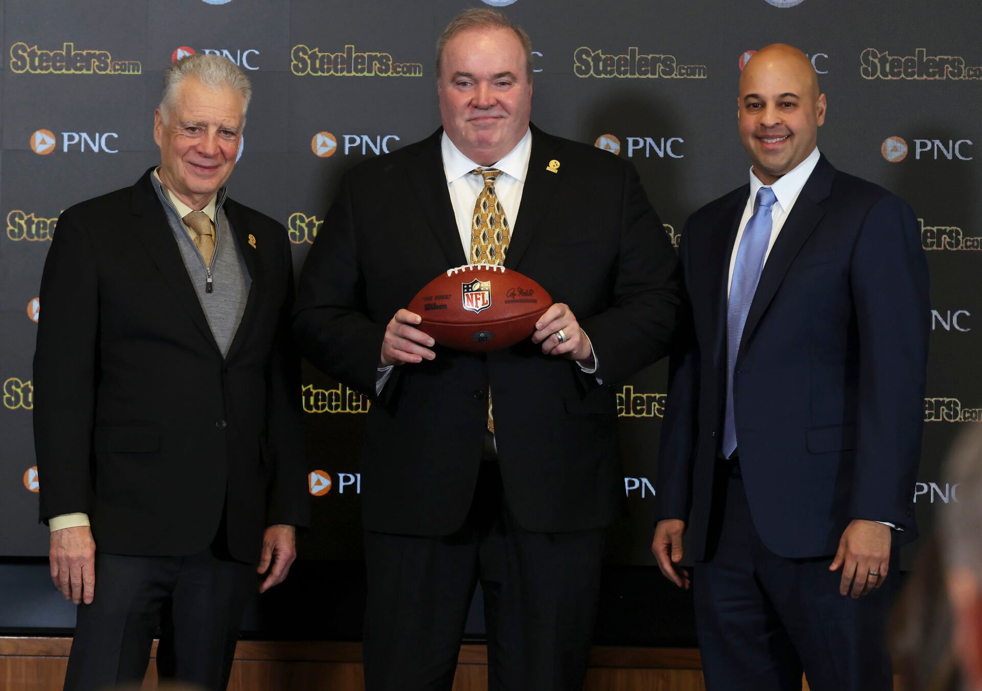 Pittsburgh Steelers owner Art Rooney II (left) and general manager Omar Khan (right) flank Mike McCarthy (middle) at a press conference announcing McCarthy as the new Pittsburgh Steelers head coach at PNC Champions Club at Acrisure Stadium..