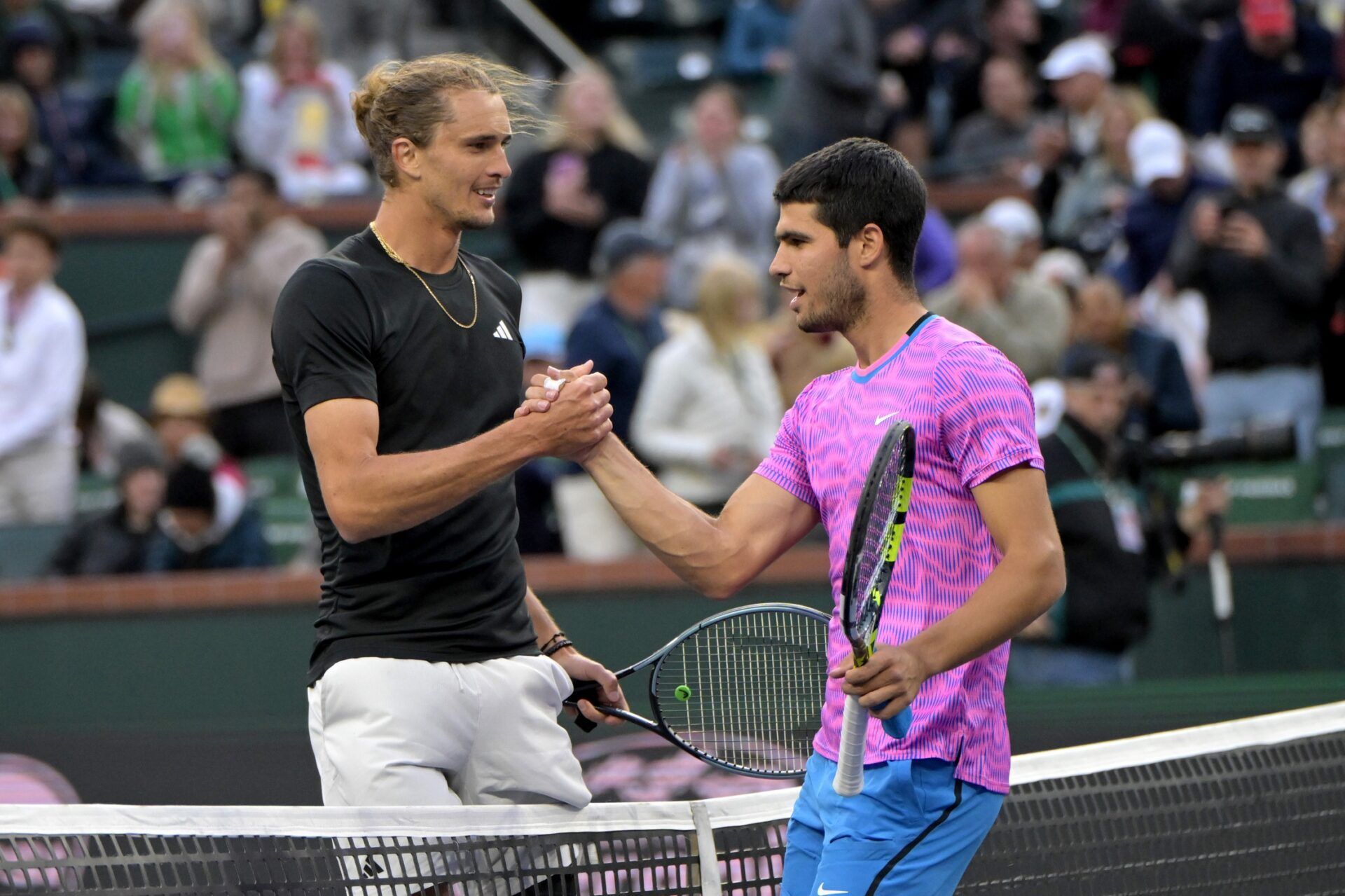 Alexander Zverev (GER)  shakes hands with Carlos Alcaraz (ESP) after their quarterfinal match in the BNP Paribas Open at the Indian Wells Tennis Garden.
