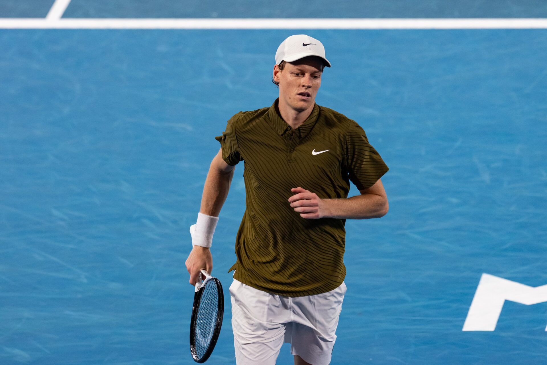 Jannik Sinner of Italy in action against Novak Djokovic of Serbia in the semifinals of the mens singles at the Australian Open at Rod Laver Arena in Melbourne Park.