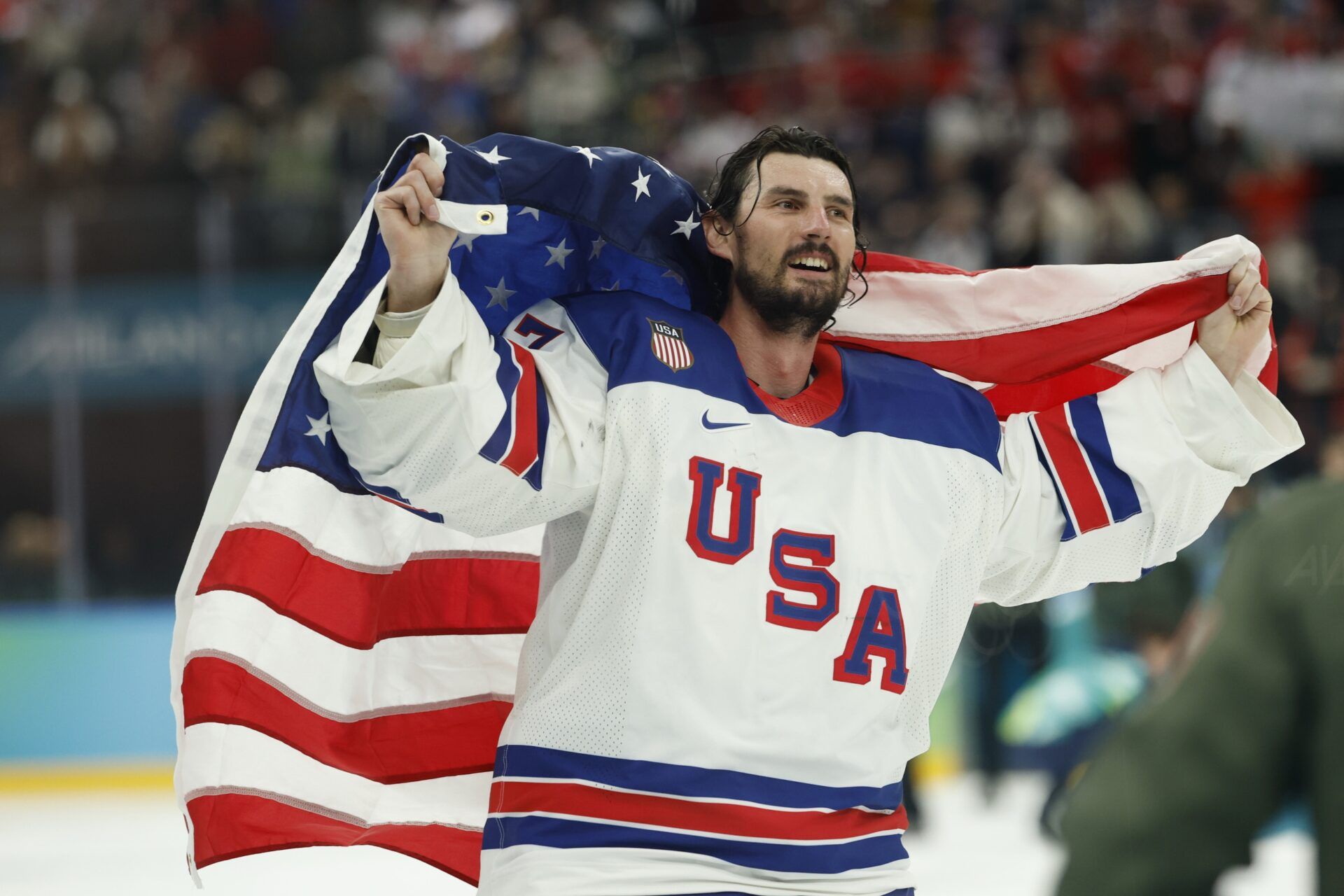 Connor Hellebuyck #37 of Team United States celebrates after winning the goal medal game against Team Canada during the Milano Cortina 2026 Olympic Winter Games at Milano Santagiulia Ice Hockey Arena.